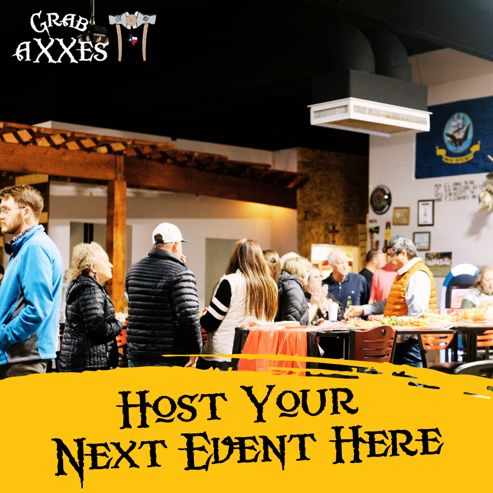 People gathered around a food table at an indoor event, with a banner that reads "Host Your Next Event Here" in front of the image.