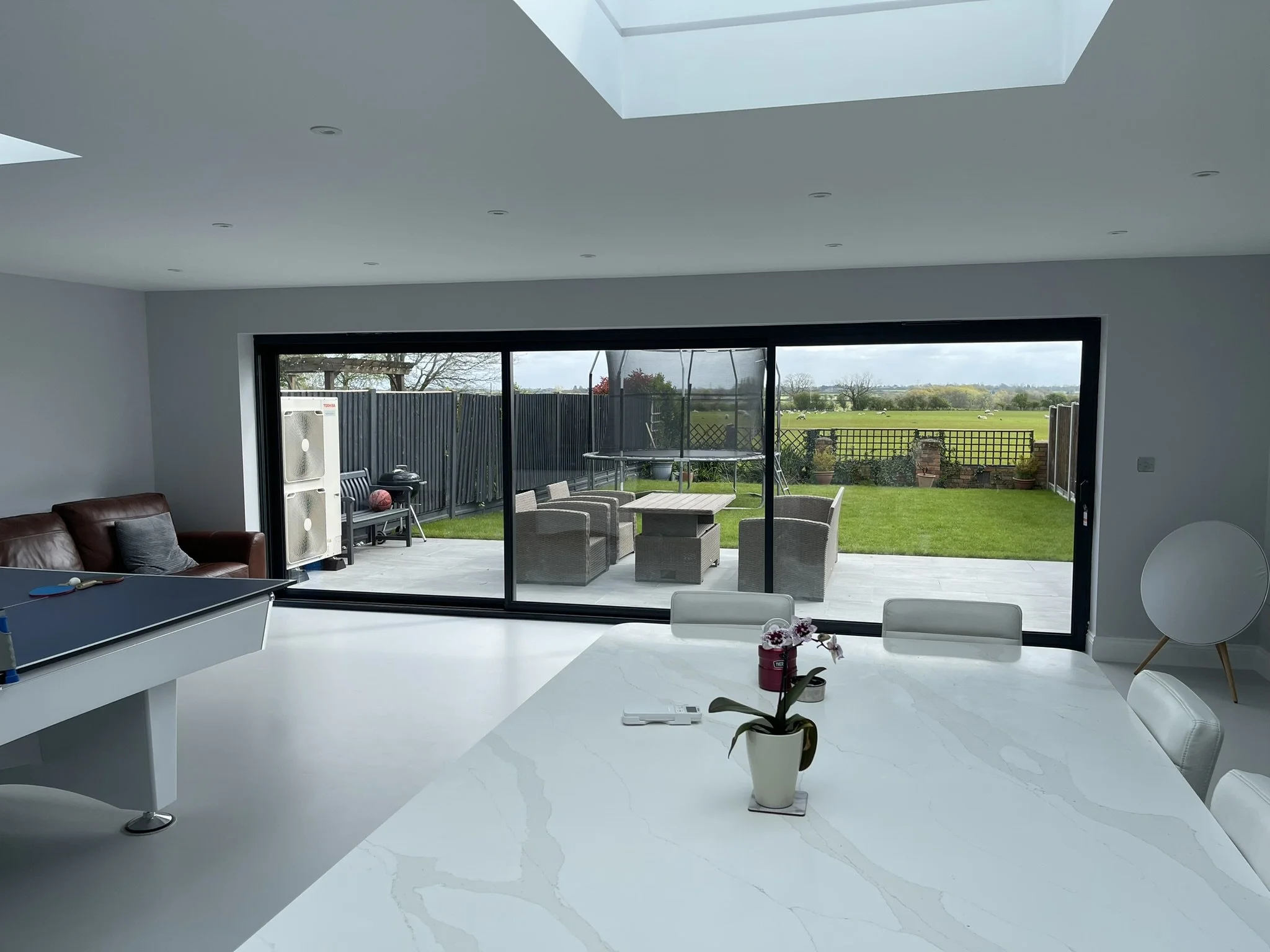 Contemporary open plan living space created with views into open countryside. 