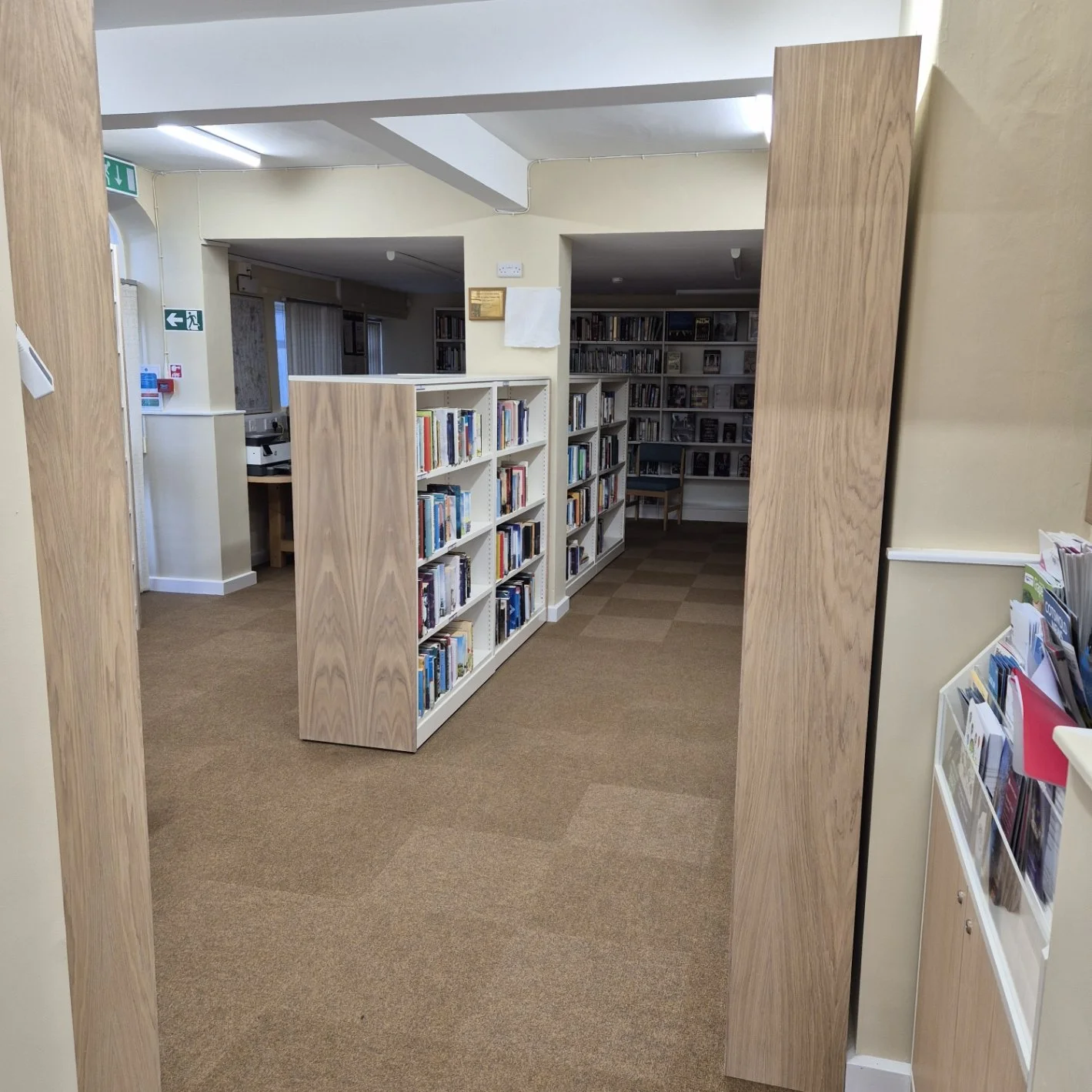 End caps for metal bookshelves in Lechlade library.