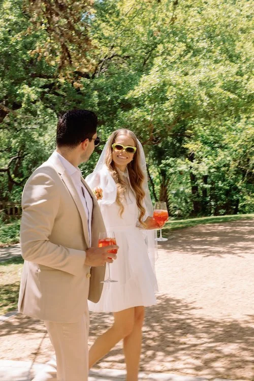 wedding photographer lindsey davidison | dallas wedding photography blog | white tuxedo | weddings wedding photography in aust, in the style of 1970s, light orange and beige, jewish life scenes, photorealistic rendering, romanticized nature, 35mm le