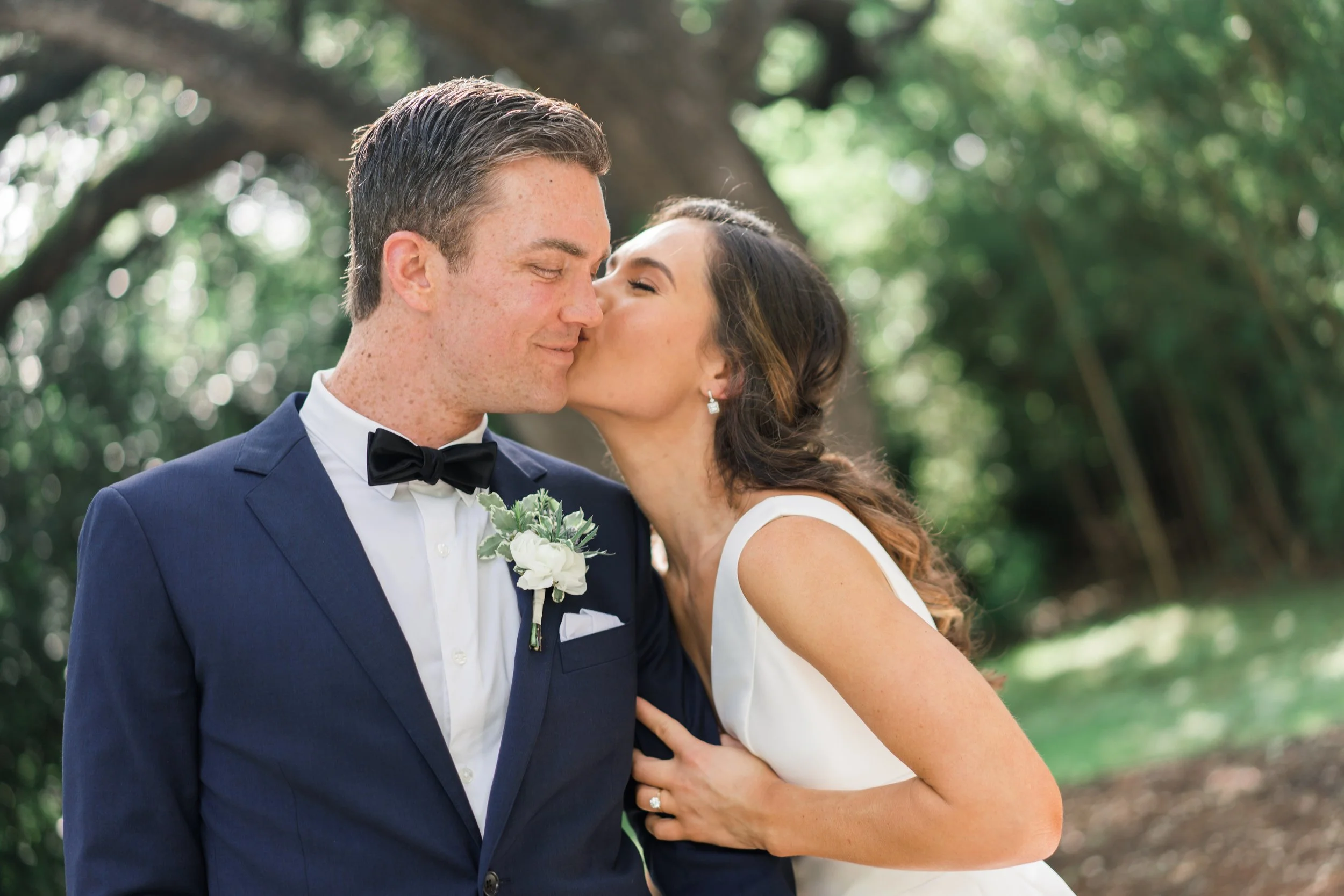 Bride sharing a sweet kiss with her groom on wedding day