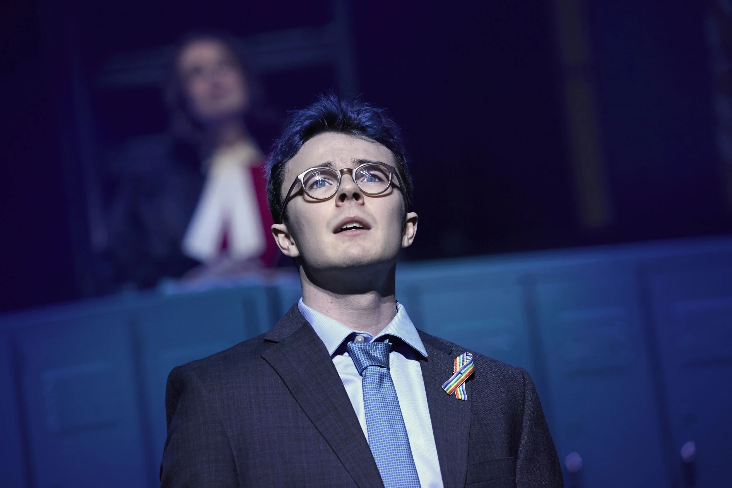 “ONLY A BOY”
Evan Kinnane as Marc Hall, and the cast of The Louder We Get at Theatre Calgary (photo by Trudie Lee). Set design: James Noone, Costume Design: Cory Sincennes, Lighting Design: Jason Hand.