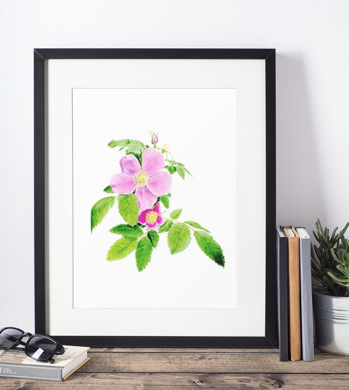 mockup-of-a-picture-frame-standing-on-a-wooden-table-and-against-a-white-wall-600-el.png