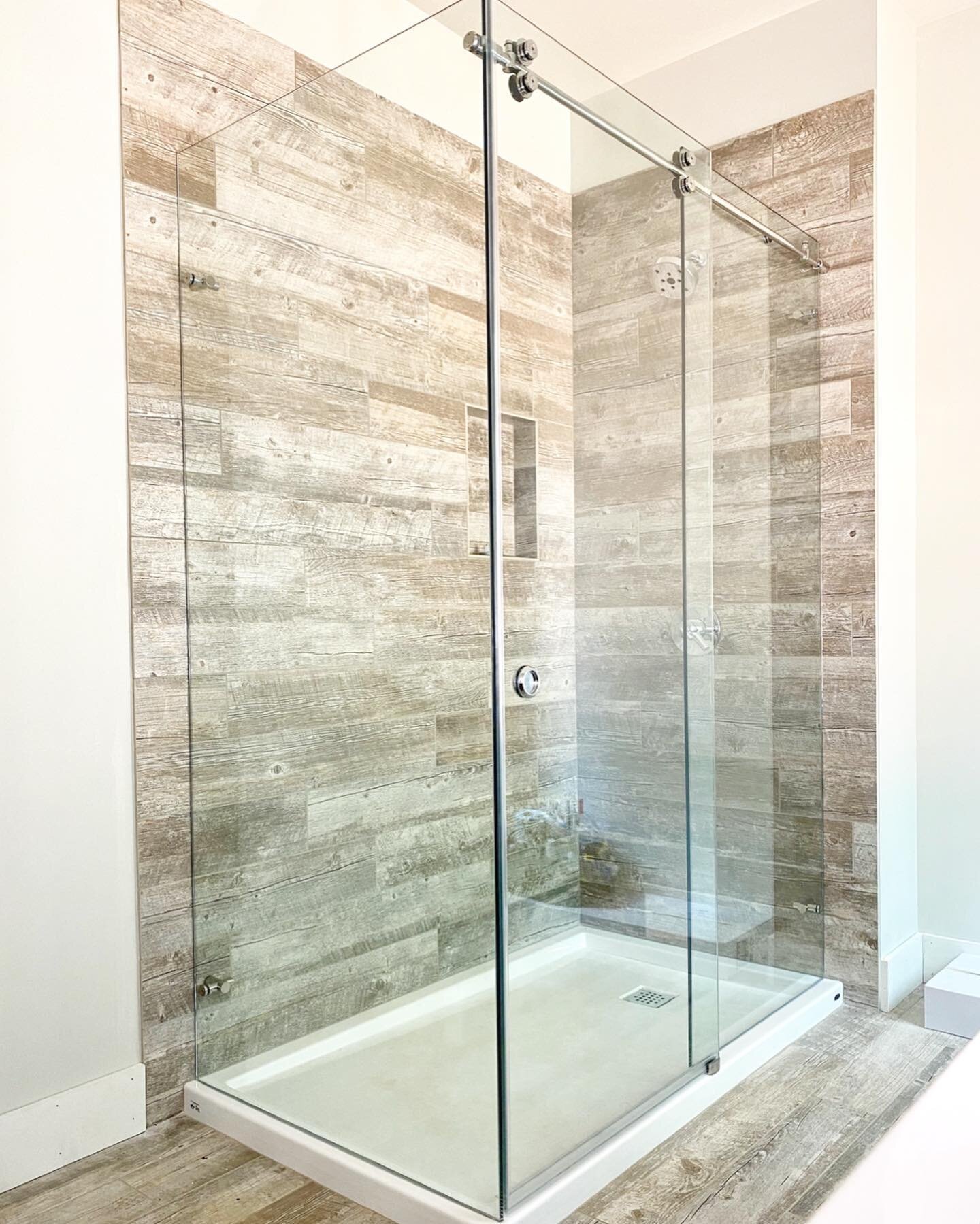 Clear glass furnished w/ polished stainless hardware to complete this fantastic shower.