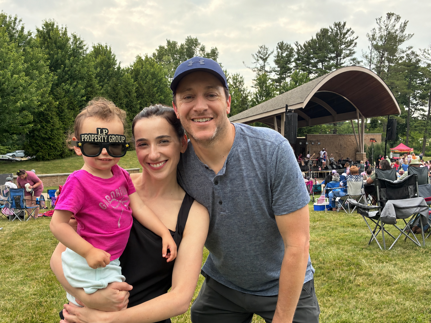 Elina, Josh and their daughter at the Grove in Mayfield Village