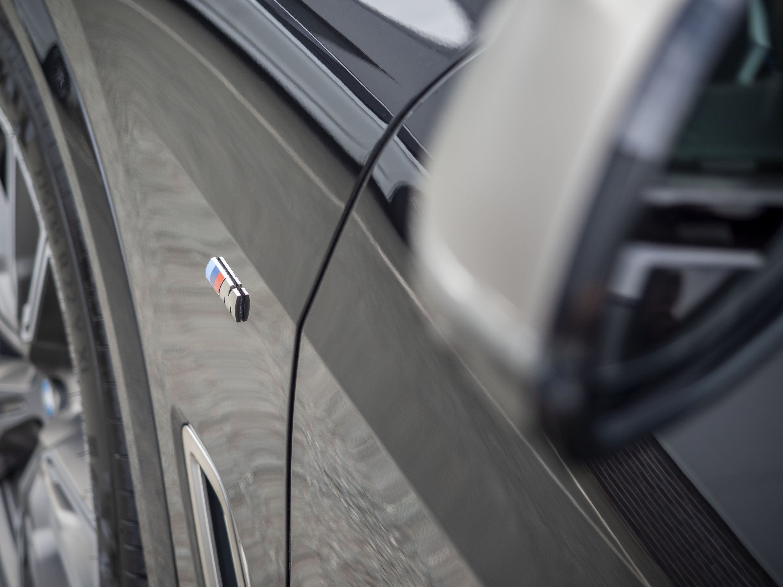 BMW X5 M50d M Side Badge 4x3.jpg