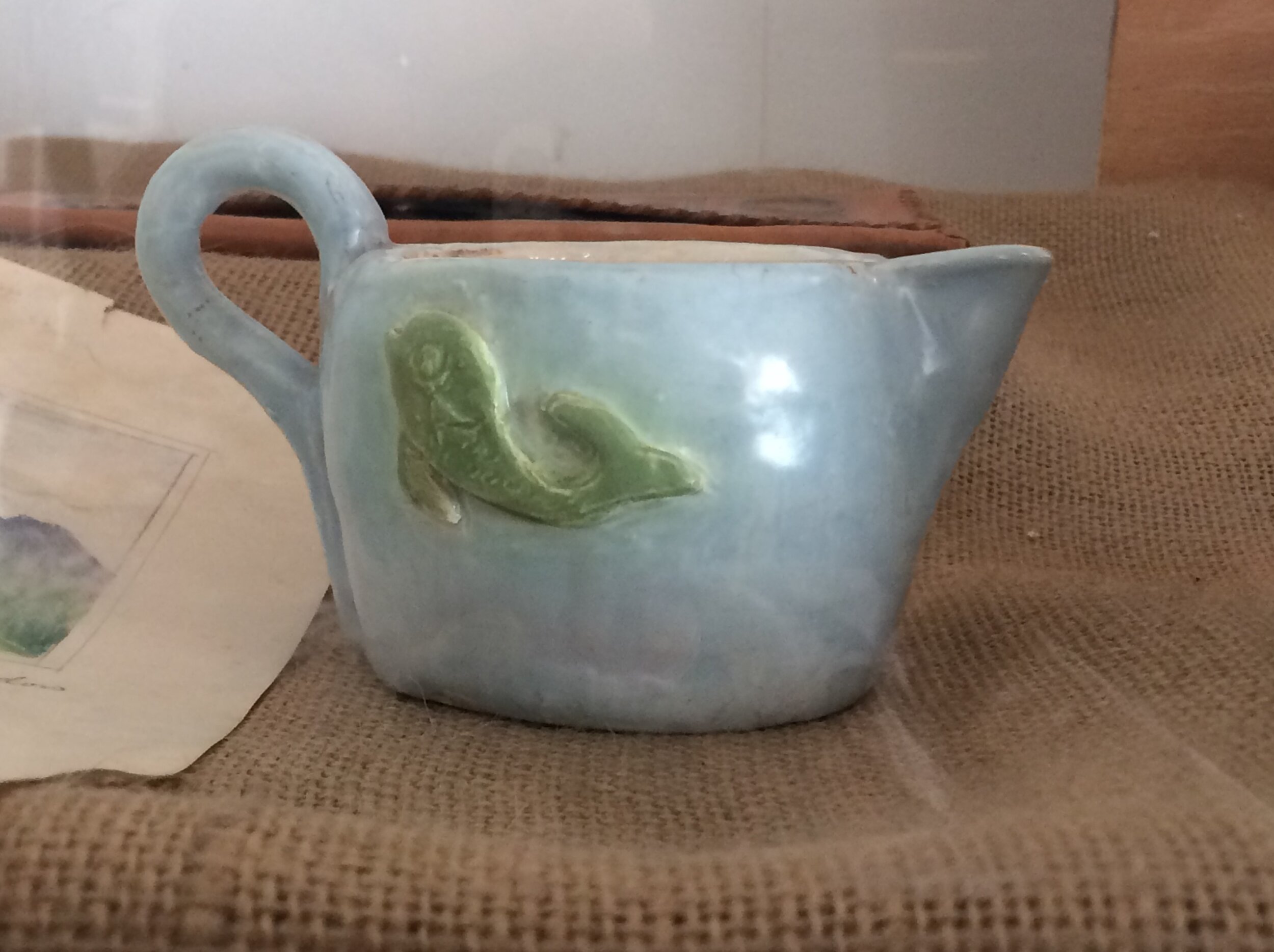  Handmade blue creamer with fish decoration inscribed by Ethel Baldwin 