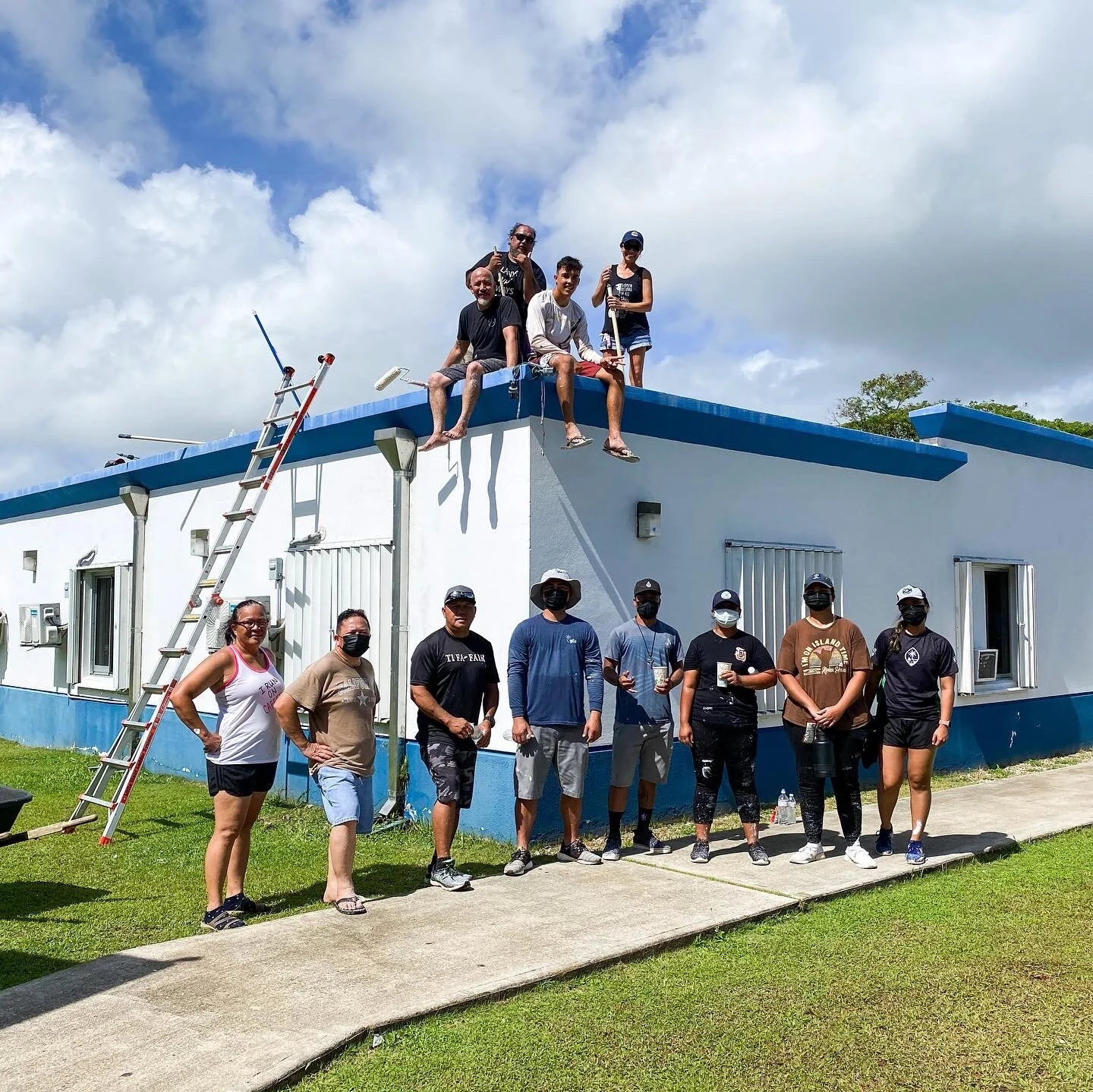 Painting rooftops at Sanctuary, Incorporated