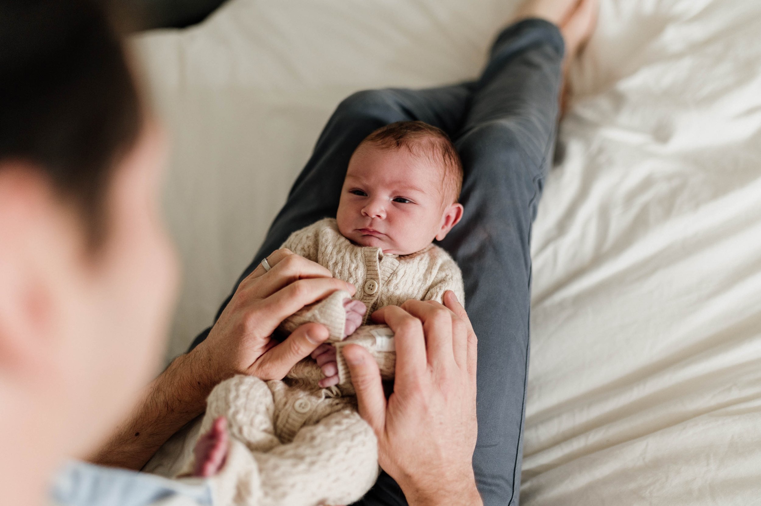 baby looking at dad