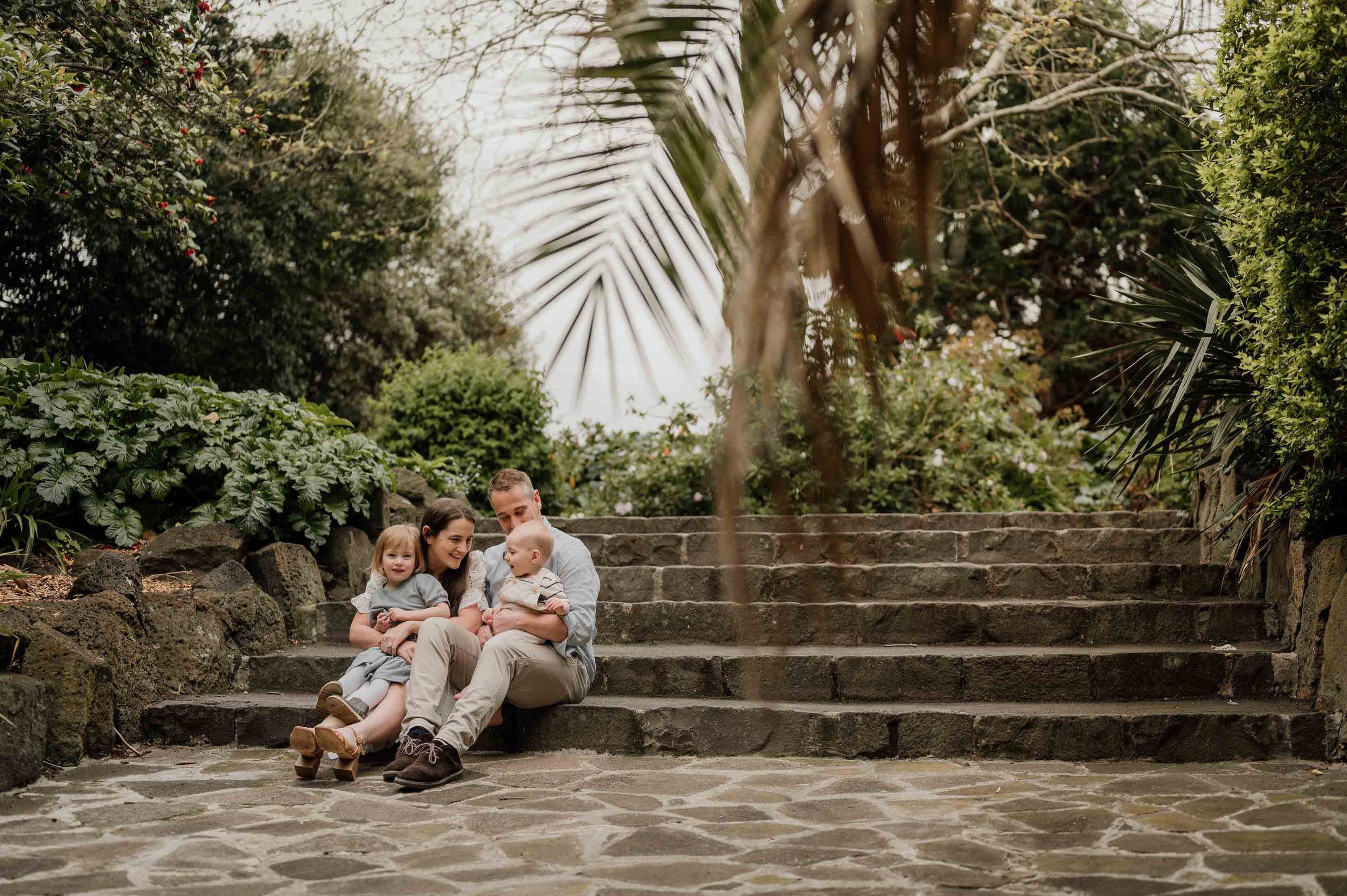 family sitting on steps