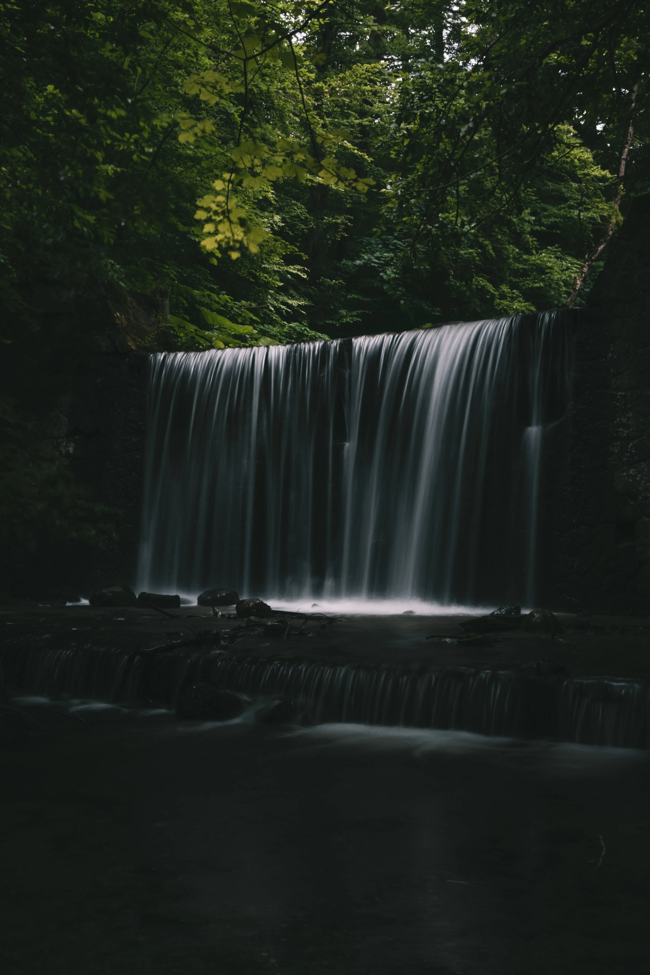 The Peleș river and one of it's many artificial waterfalls captured on 12/07/2020