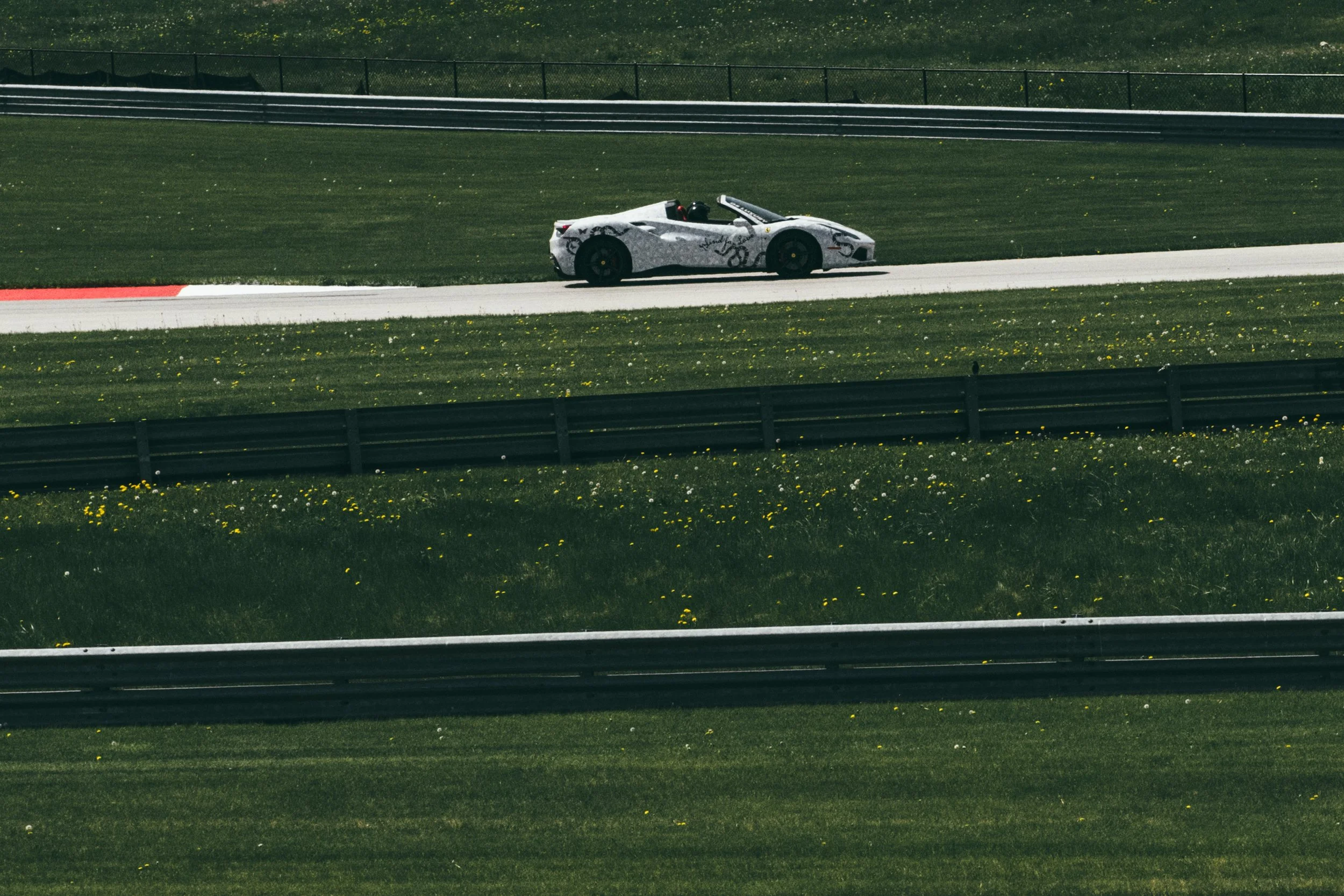 Goyard_Gucci_Ferrari_488_Spider_2017_at_Autobahn_Racetrack_Closeup_Panning_DSLuxury_Rental.jpg