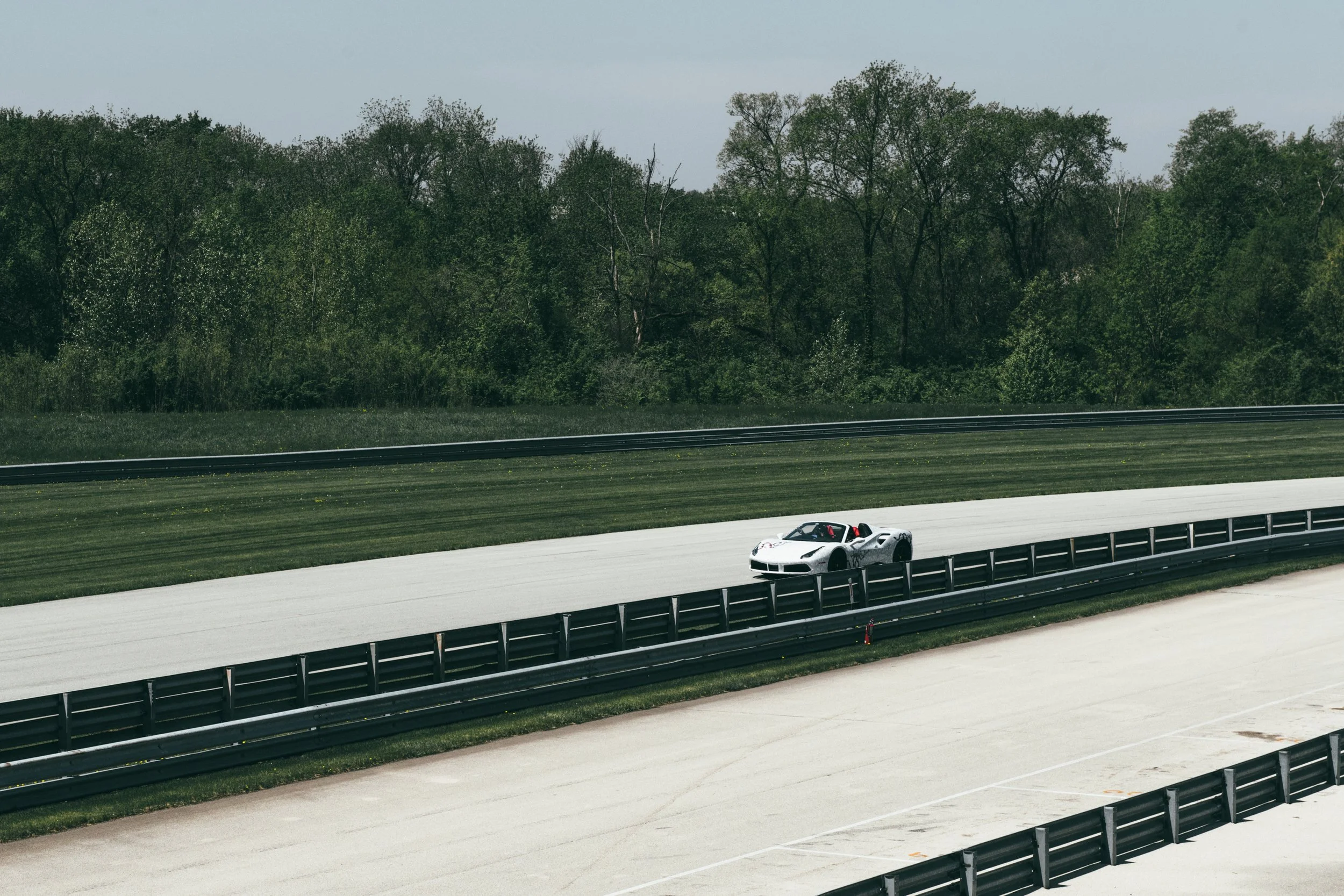 Goyard_Gucci_Ferrari_488_Spider_2017_at_Autobahn_Racetrack_Distant_Front_Panning_DSLuxury_Rental.jpg