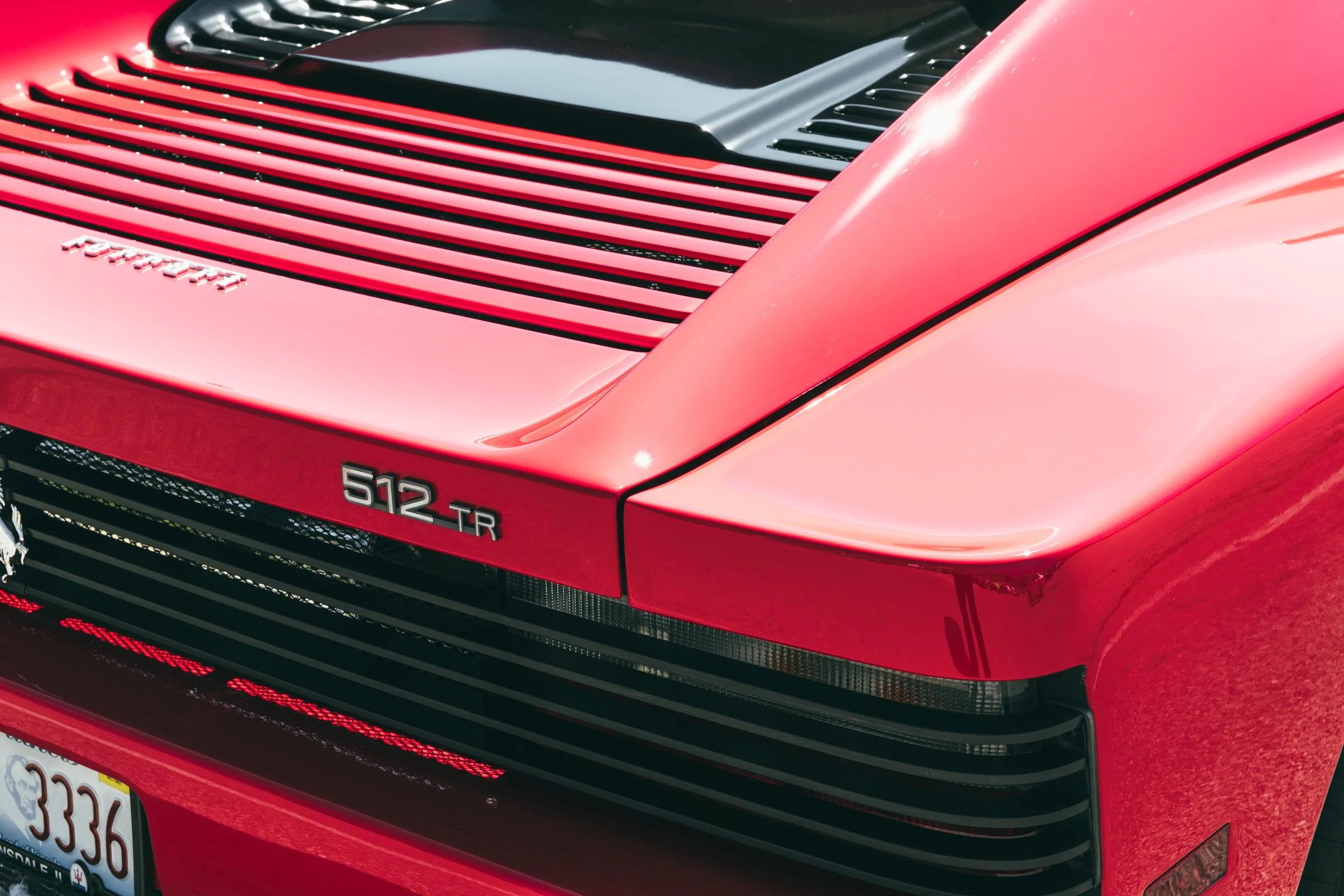 Red_Ferrari_512TR_at_Autobahn_Racetrack_Badge_DSLuxury_Field_Day.jpg