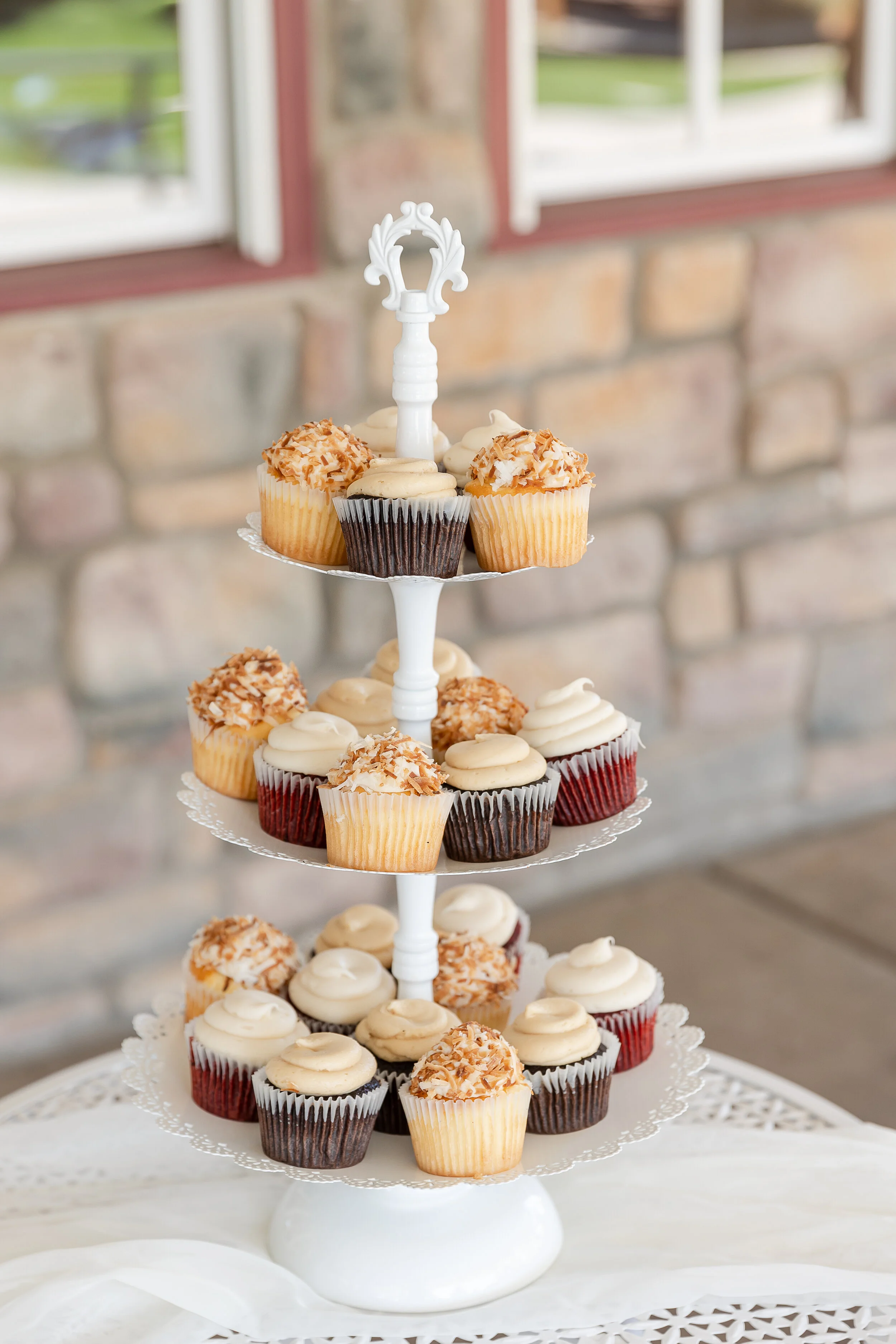 3 tier white cupcake tower with 24 cupcakes