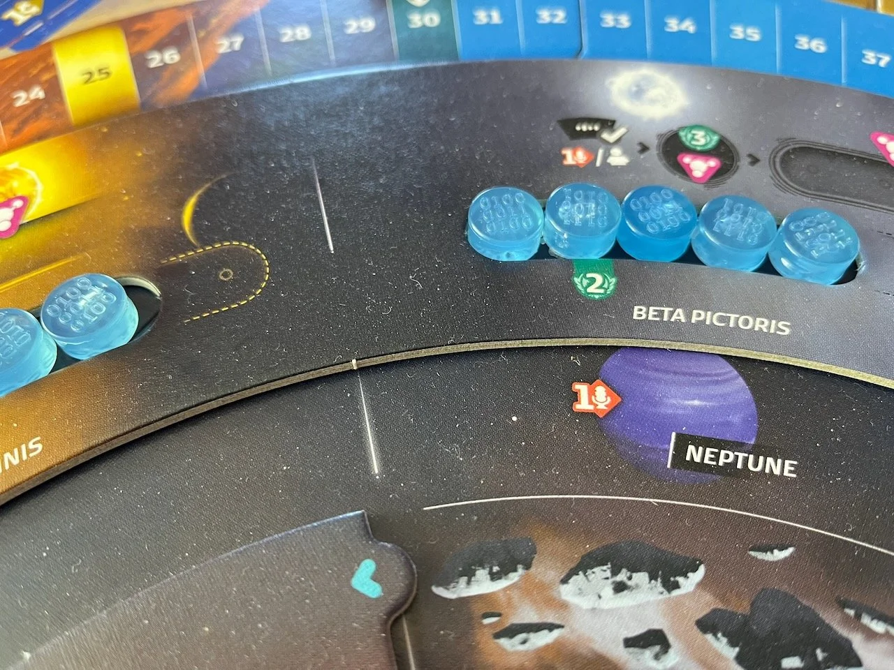 Closeup of blue data tokens in the Beta Pictoris board secftor of the SETI board game