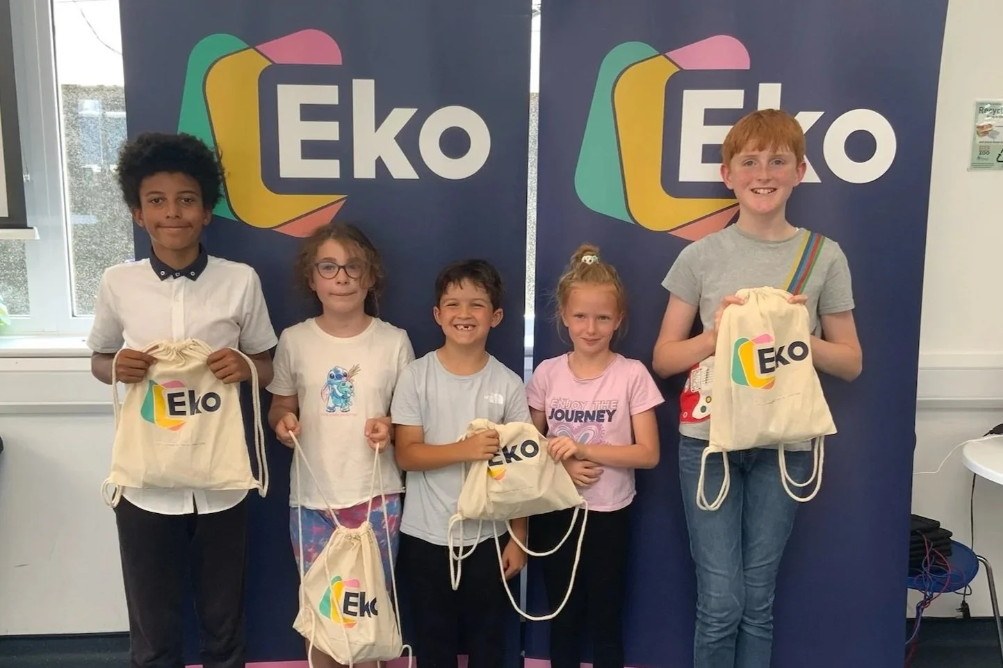 Proud students show off their goody bags for attending a STEM enrichment summer programme sponsored by Defence Nuclear's EKO programme