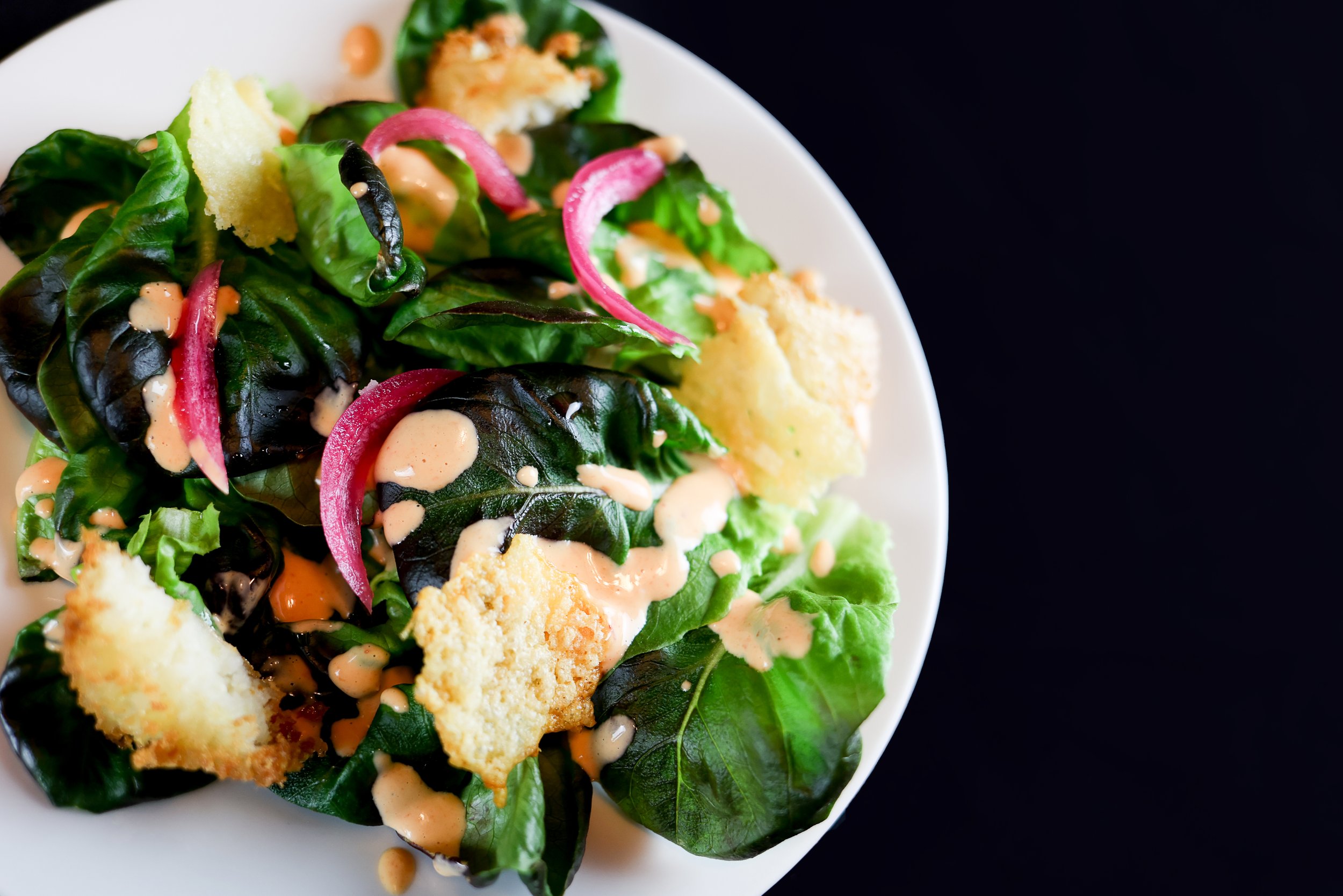 Tex Mex Caesar Salad- Polenta Crouton, Cheese Crisps + Pickled Red Onion