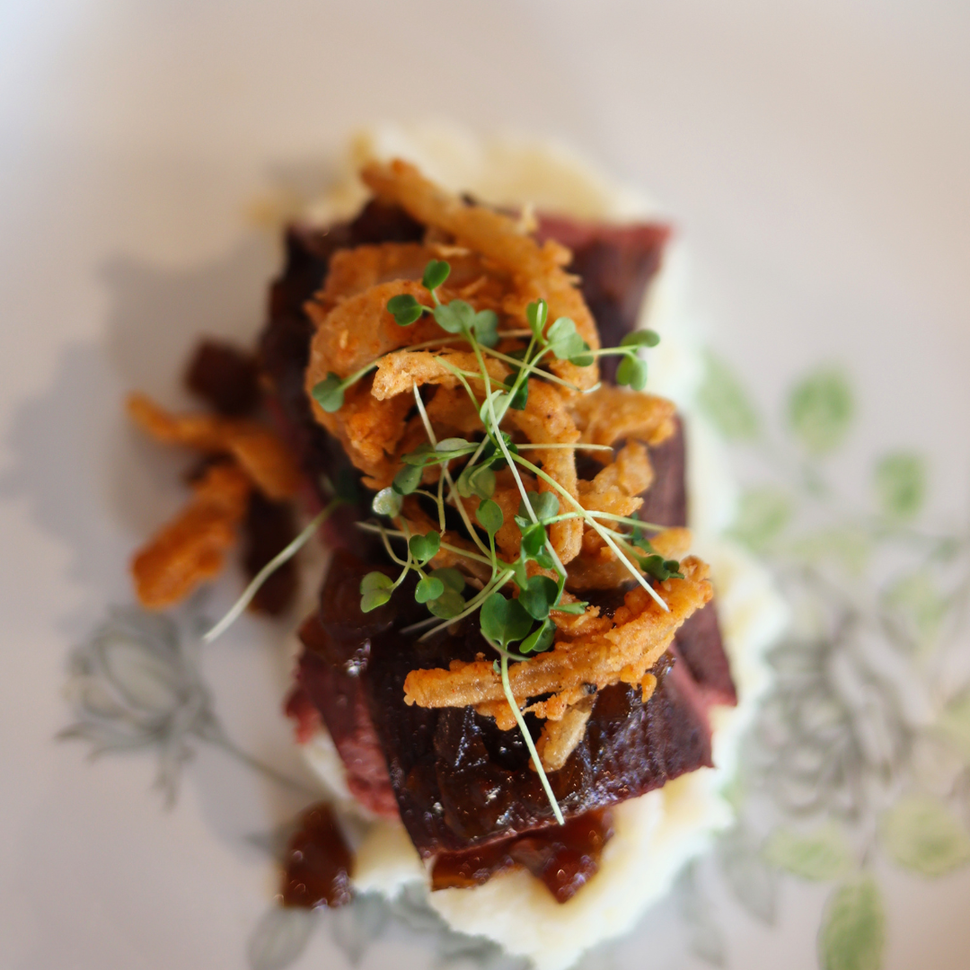 Chef's Cut of Beef With Bourbon Onion Jam, Potato Puree, and Fried Onion