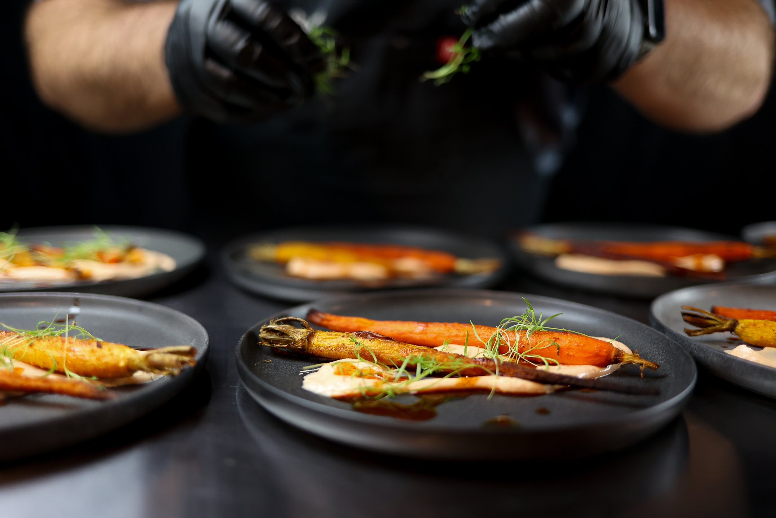 Sweet + Smoky Carrots with smoky paprika yogurt, dukkah (seasoned nut crumble) + micro carrot