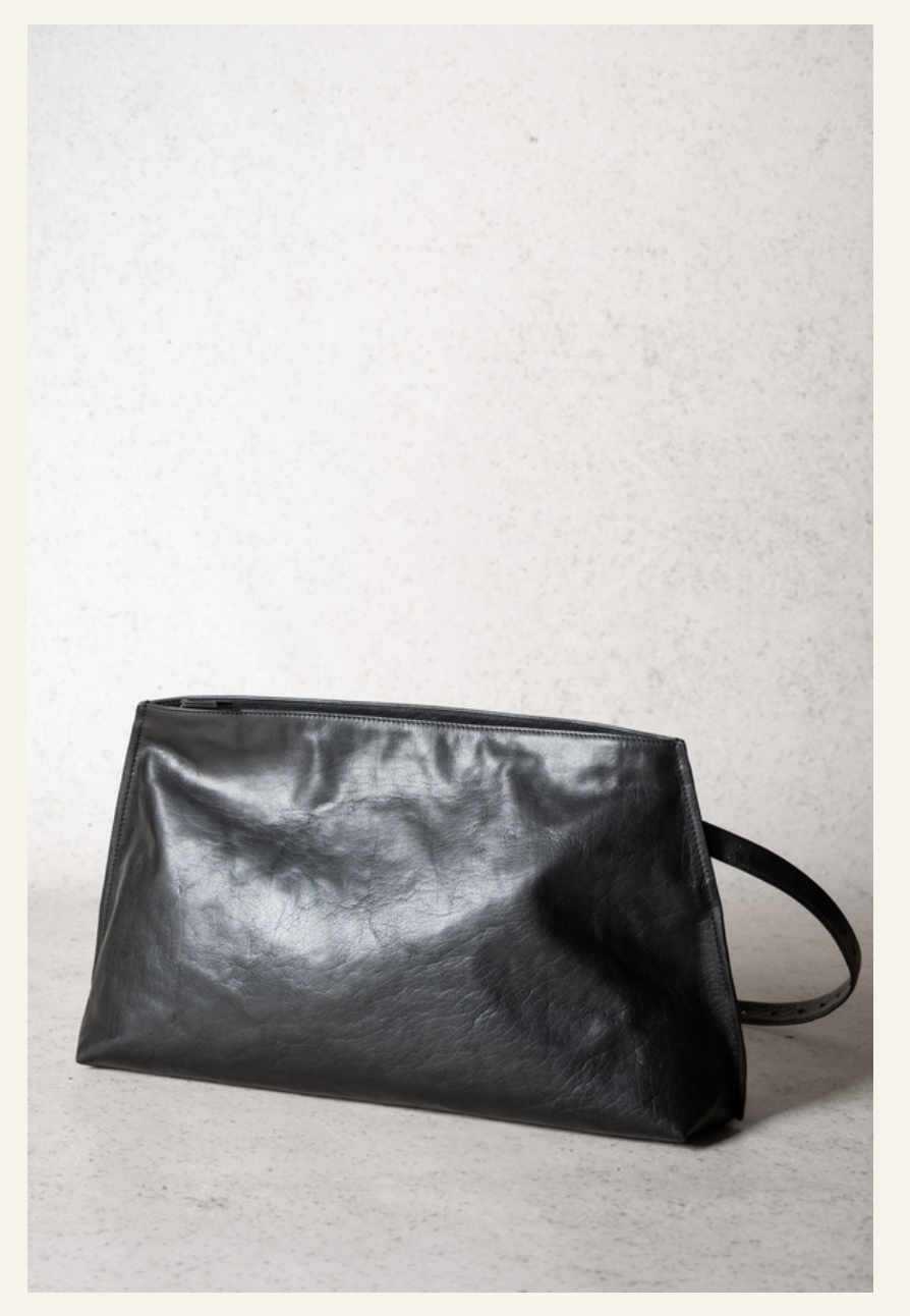 Lihann George Tani Bag in black crushed grain leather worn over the shoulder — Sabine Kohler Boutique.png