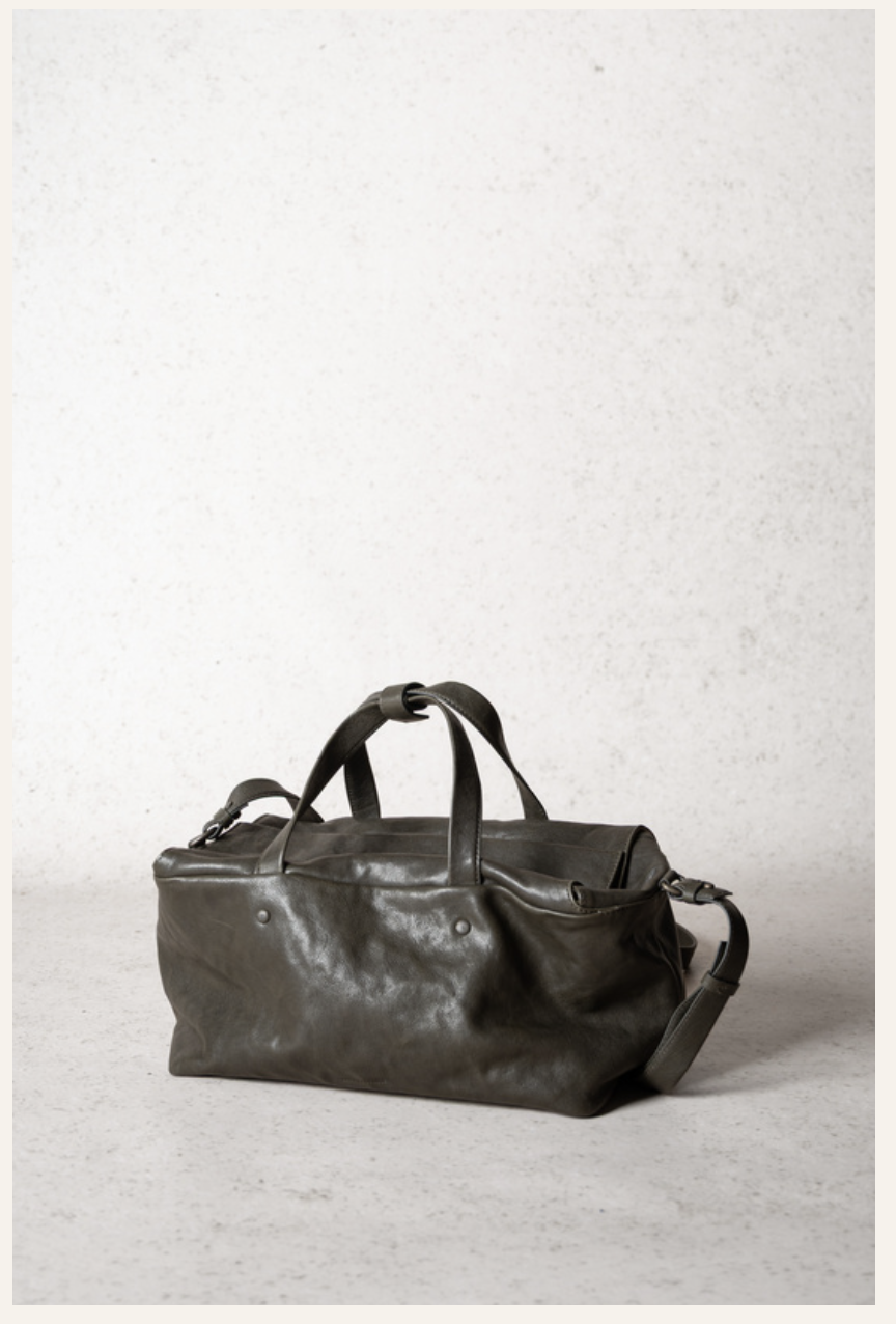 Lihann George Lili Bag in matte natural grain leather held under the arm — Sabine Kohler Boutique.png