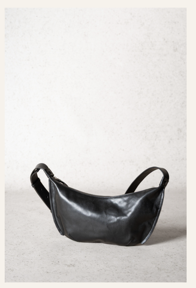 Lihann George Bani Bag in black crushed grain leather worn over the shoulder — Sabine Kohler Boutique1 .png
