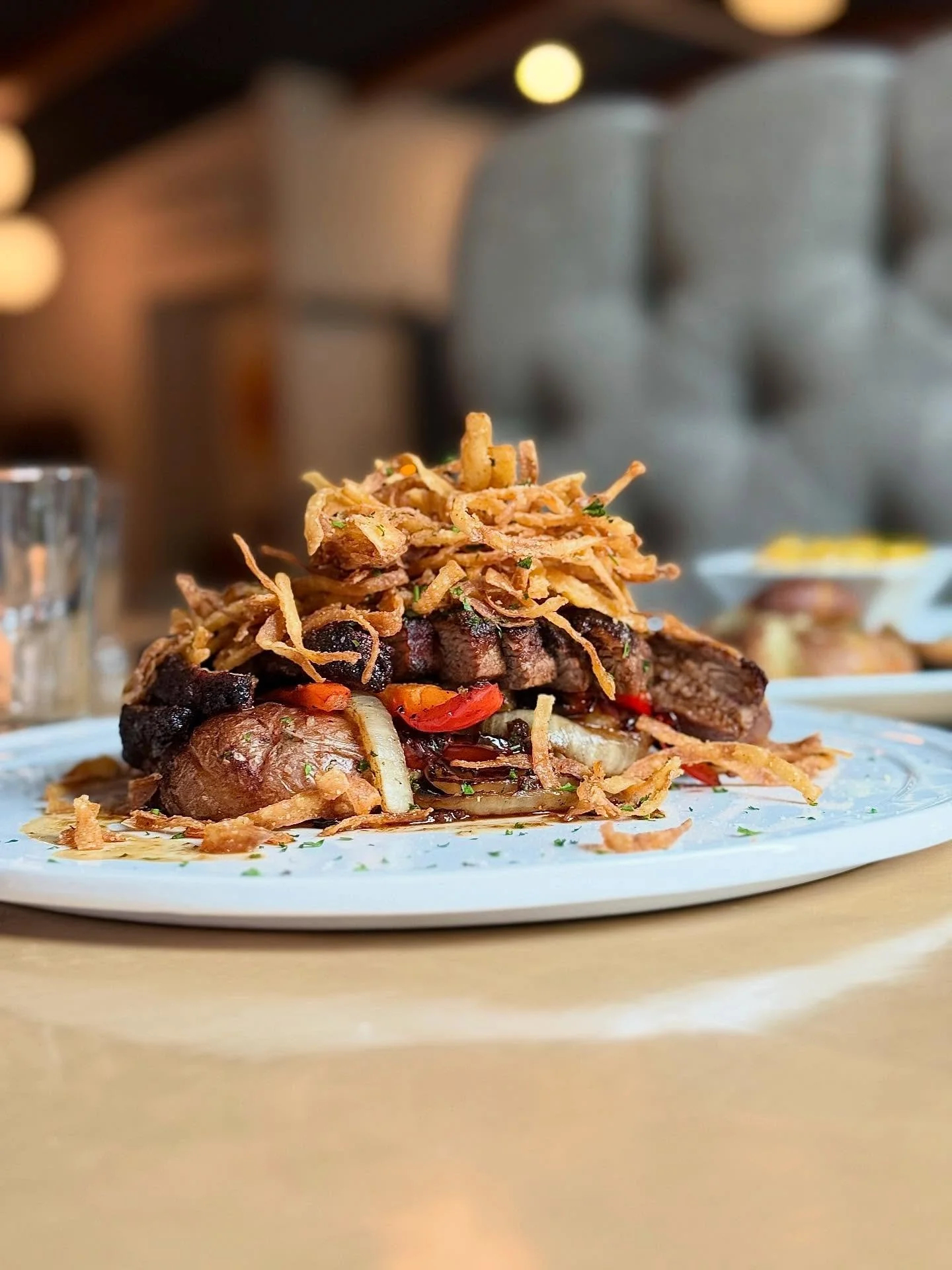 New feature alert! 
Campfire steak     
8 oz prime flank steak, coated in brisket rub, pan-roasted medium-rare, roasted baby reds, charred onions and peppers, gochugaru short rib jus, and crispy tabasco onions on top.
Make y