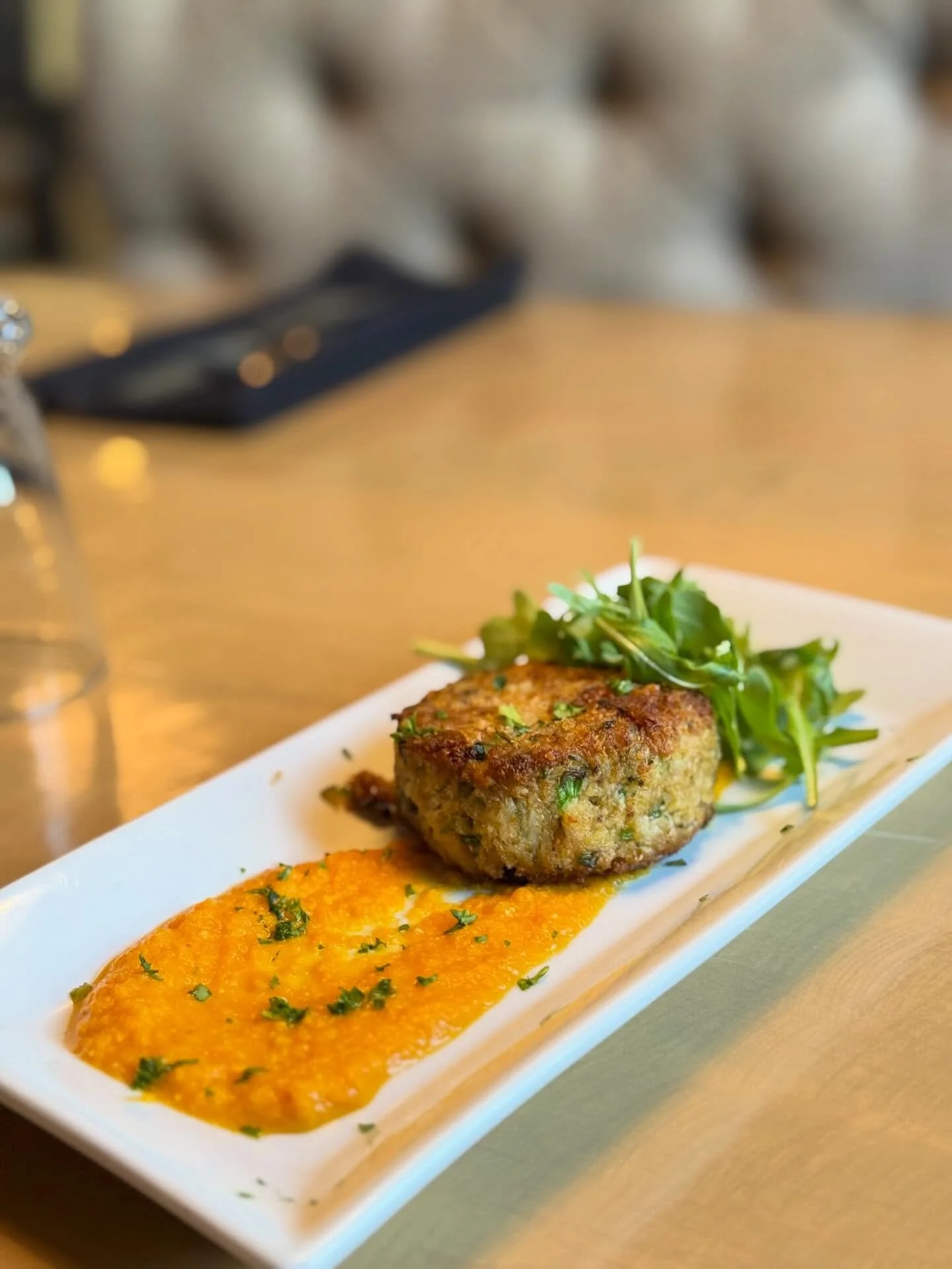 Featured this week! 
Lump Crab Cake 
Pan-seared lump crab cake, romesco drizzle, and fresh arugula.

Make your reservation on our website!
Lostkeytap.com
.
.
.
#crabcake #depere #foxvalleyfood #greenbayfoodie #restaurant