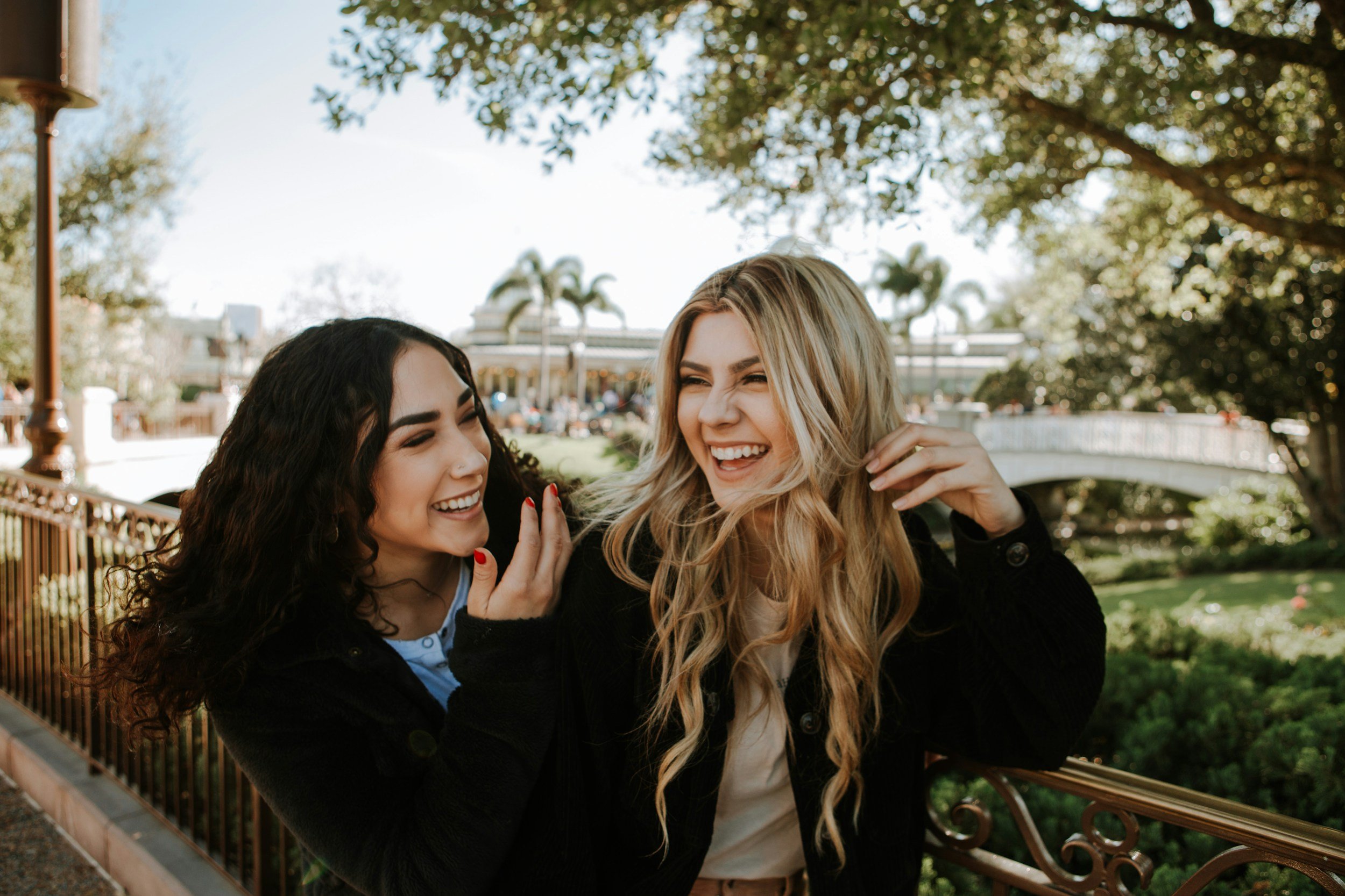 two women friends laughing together
