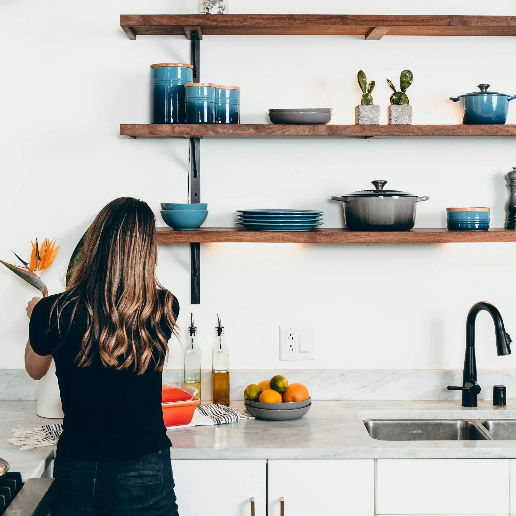 Woman setting up a new home and kitchen after divorce