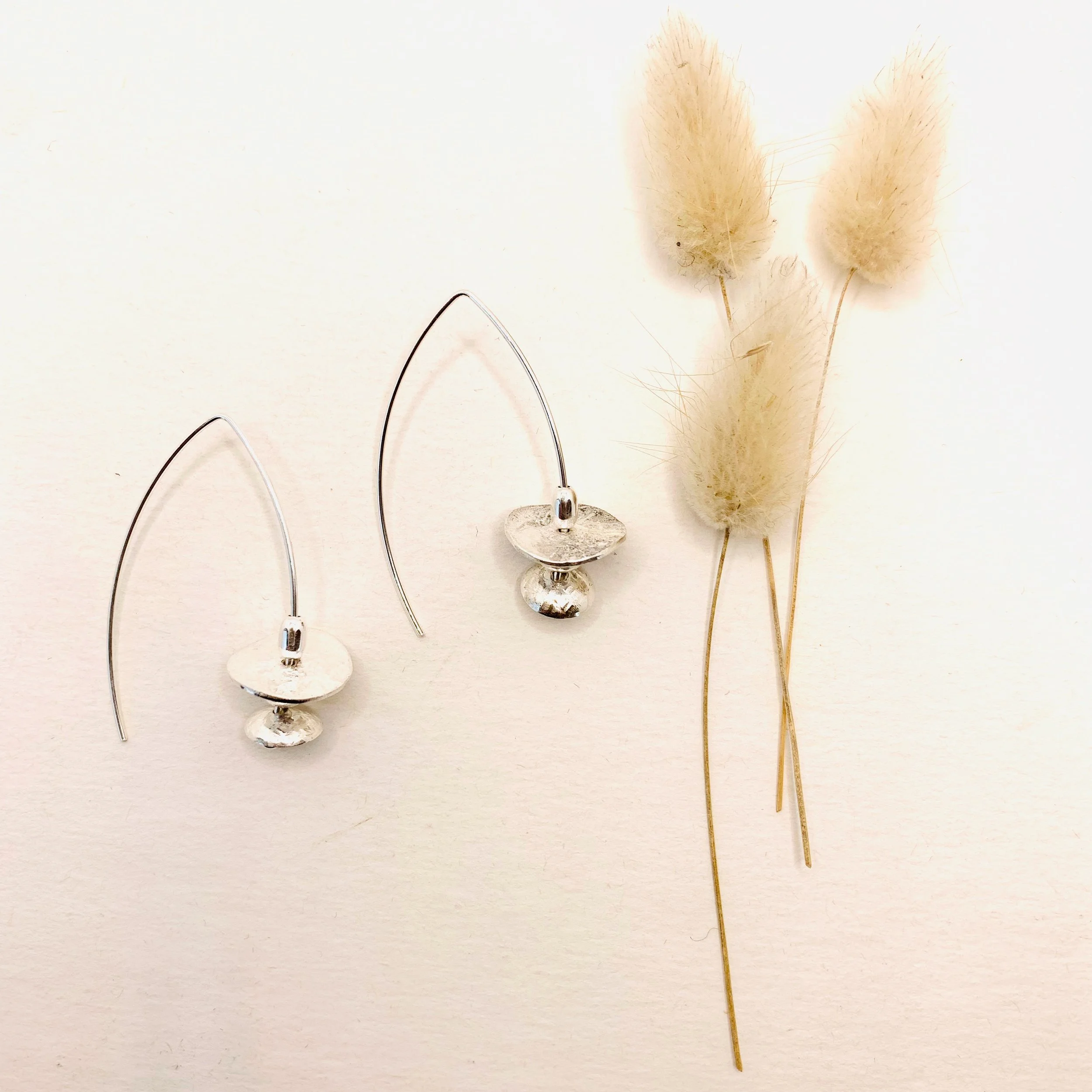 Contemporary silver disk earrings