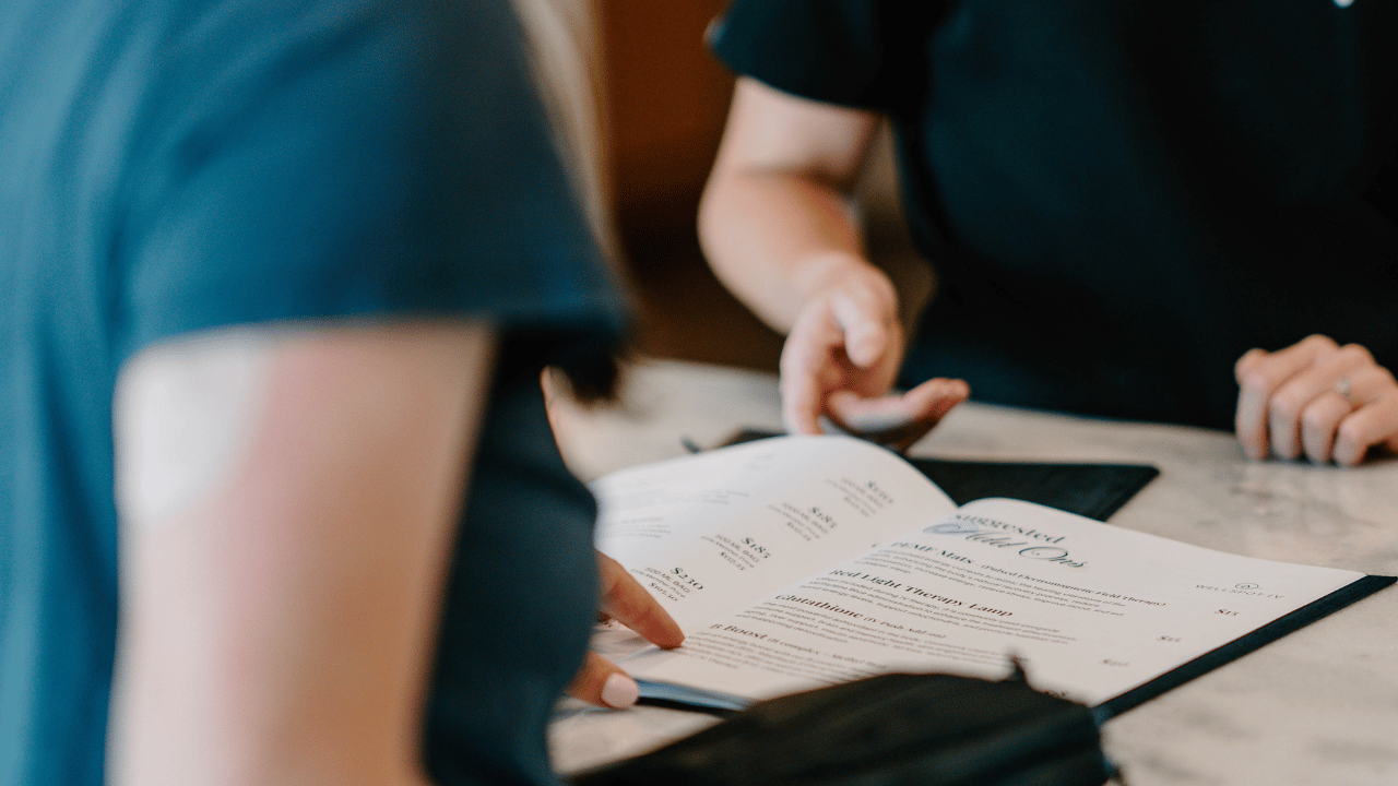 fingers pointing to book