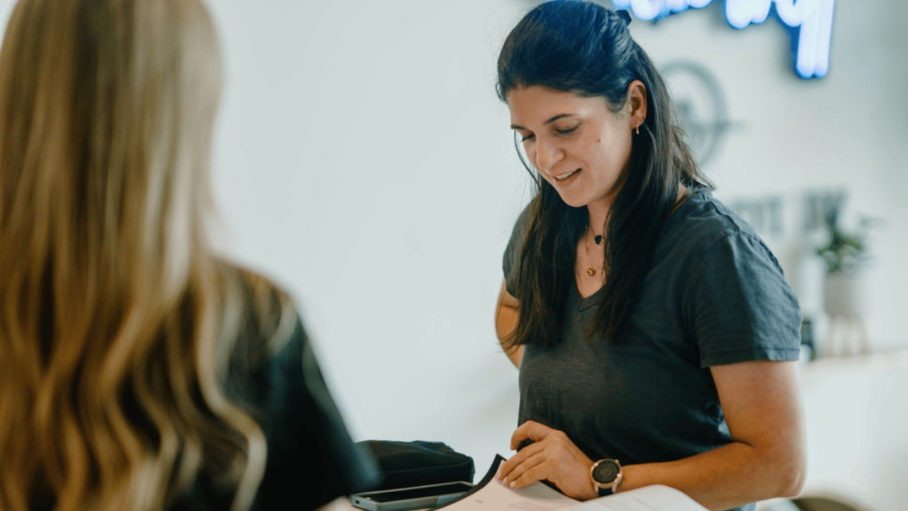 woman turning pages of a book