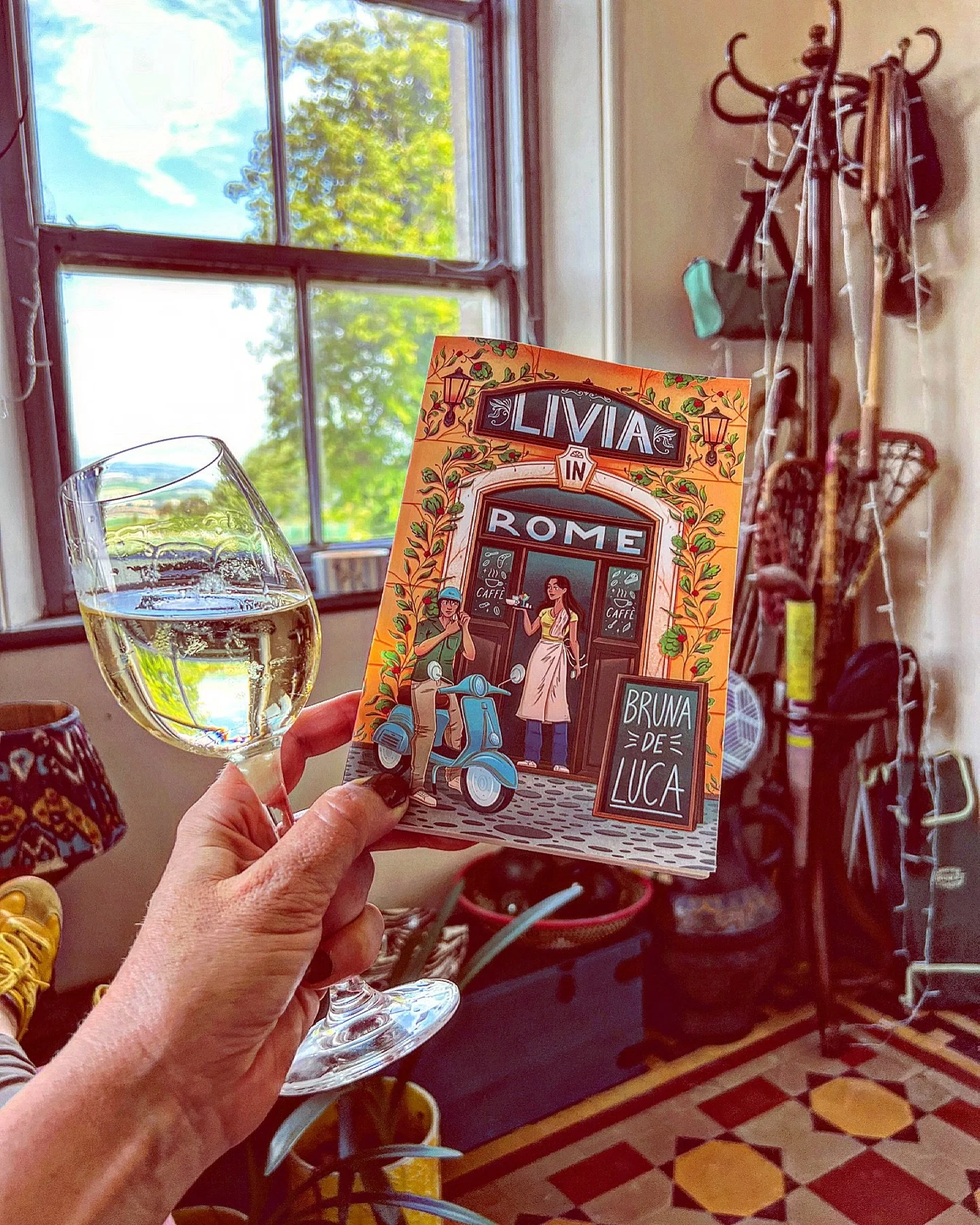 Yesterday the Weather felt like a Summer in Rome! Today, after the thunderstorms and rain, I&rsquo;m hiding in my porch with a glass of Italian white wine, channeling a romantic summer get away, with Bruna De Luca&rsquo;s YA debut: Livia in Rome! #su