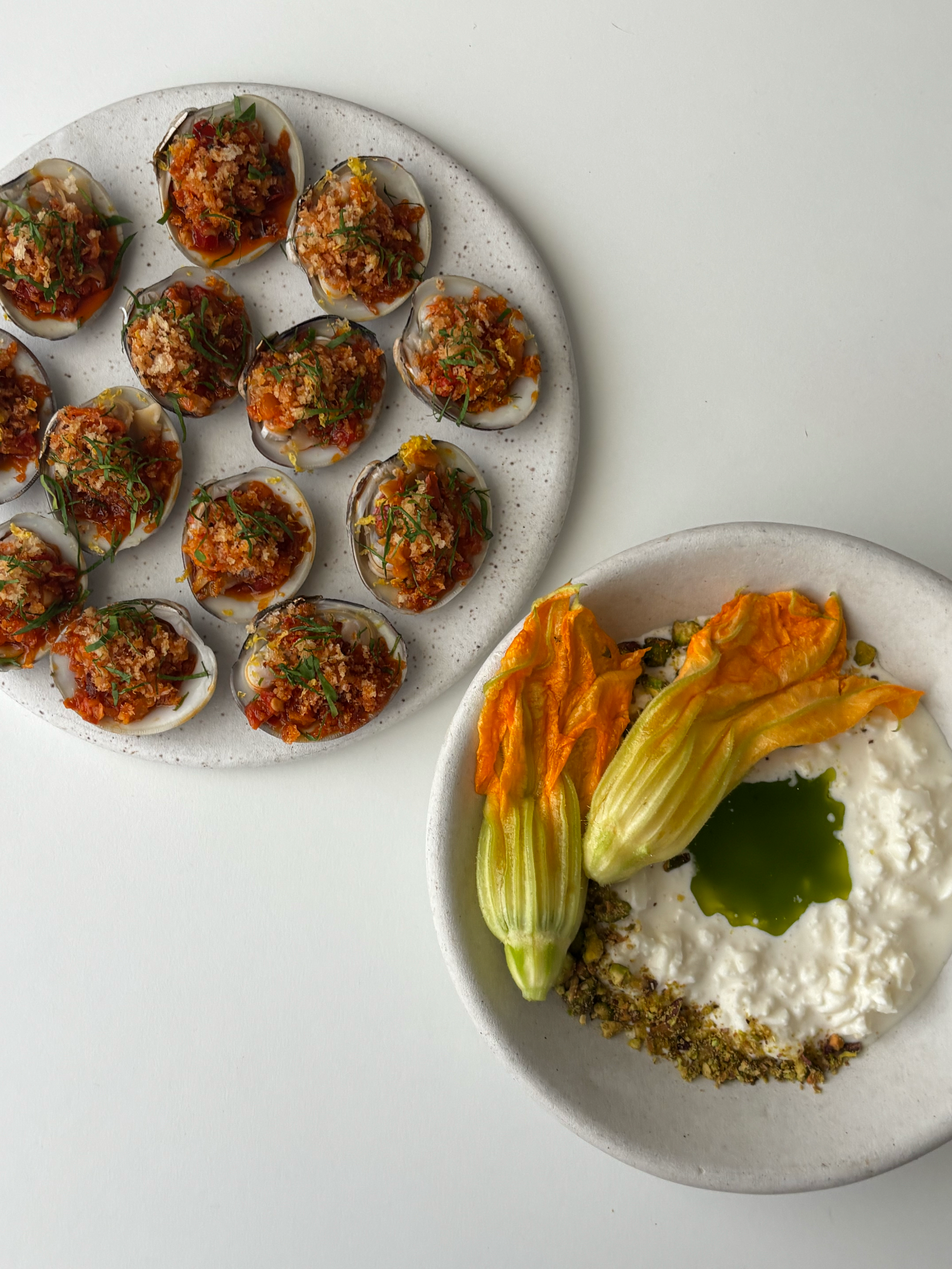 Stracciatella with Parsley Oil, Pistachio Dust, Squash Blossoms & Clams Casino
