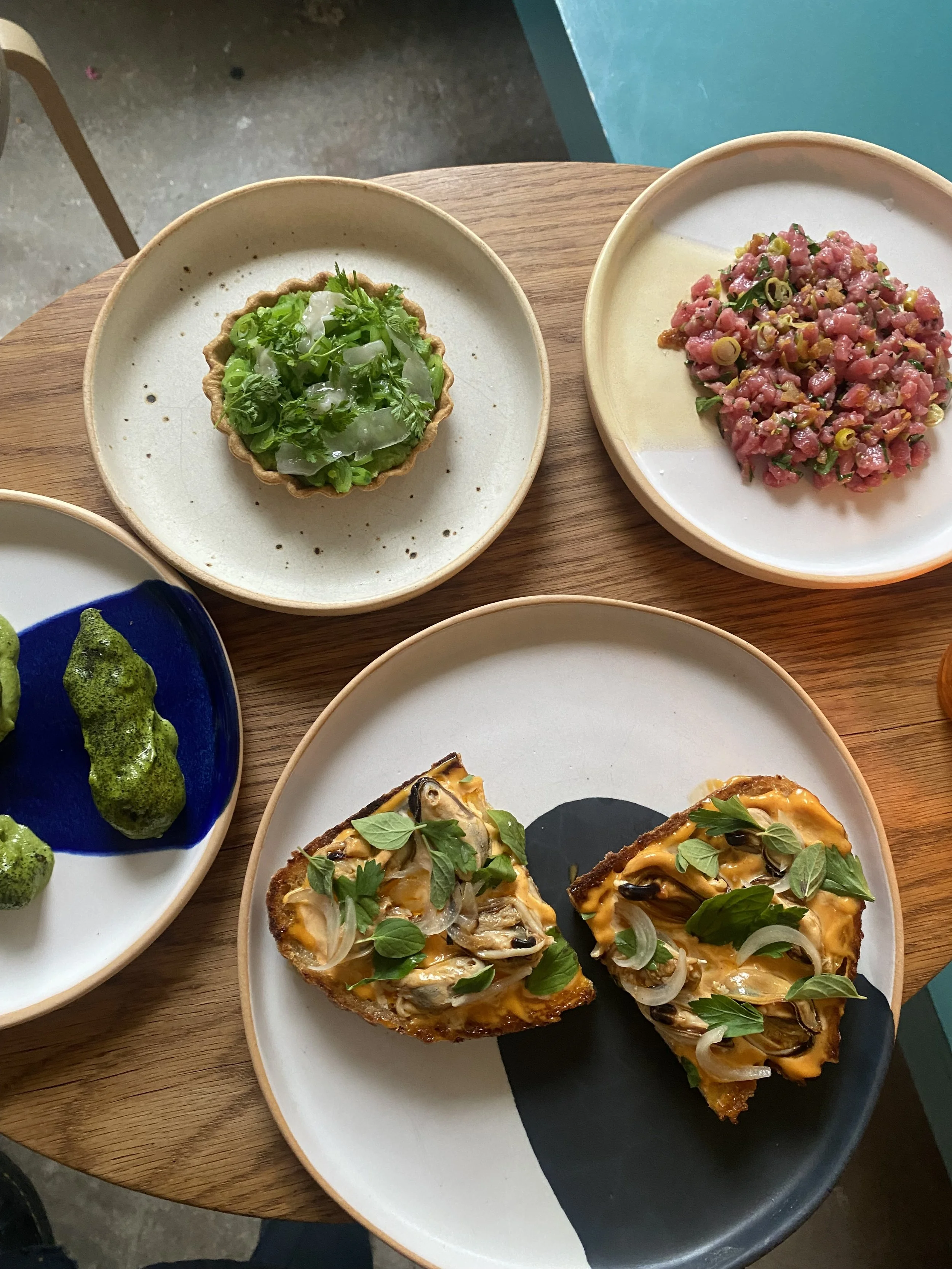 Sunchokes in Aji Verde, Basque Steak Tartare, Spring Pea Tart, Pickled Mussels Toast