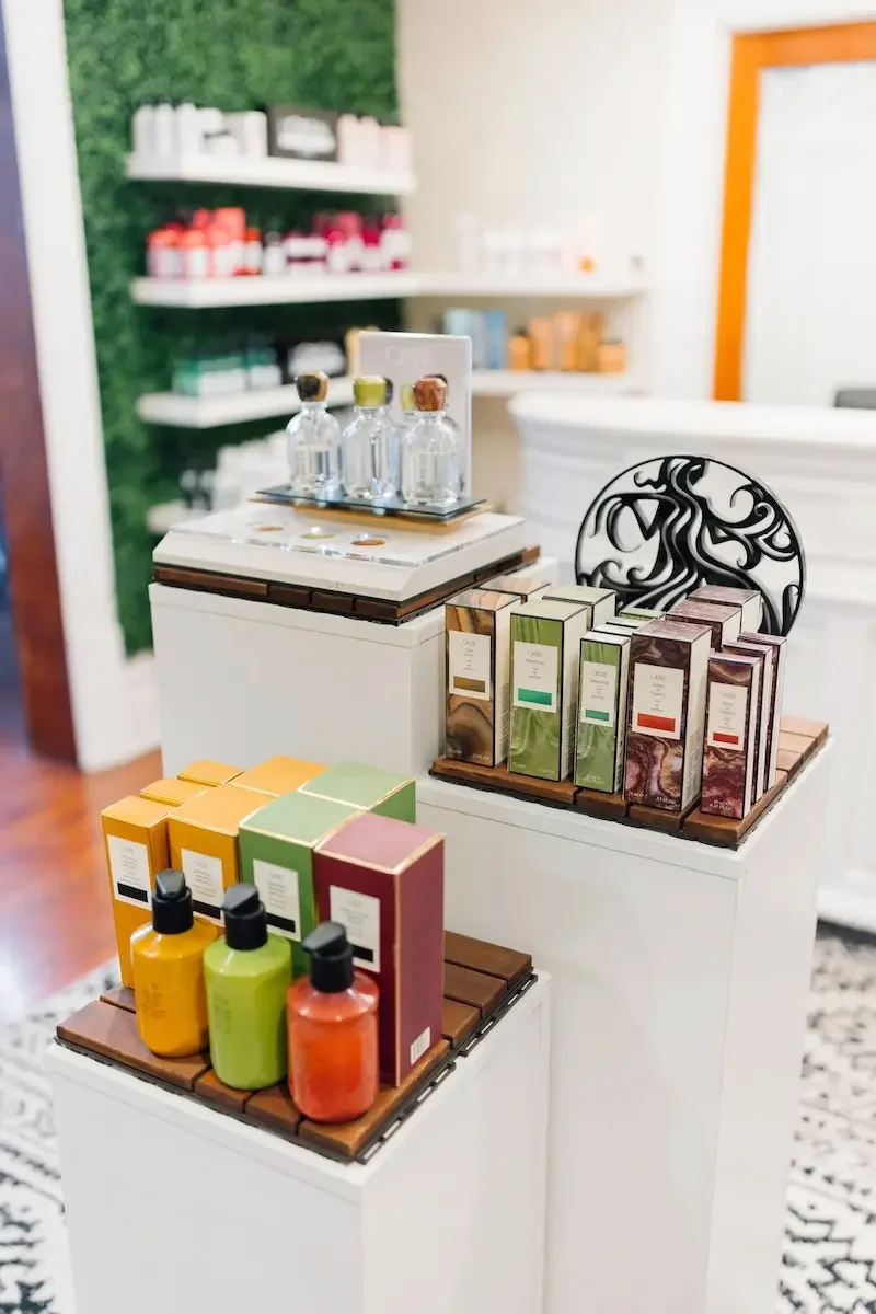Display of professional haircare products available at The State Co salon in Livermore, CA.
