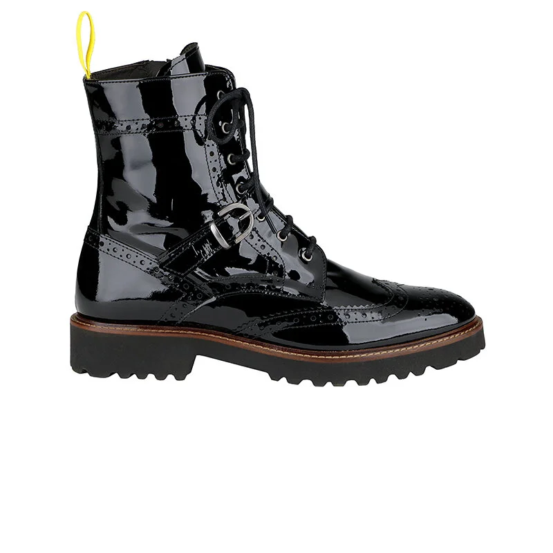 Black patent leather lace-up boot with brogue detailing and a chunky sole.