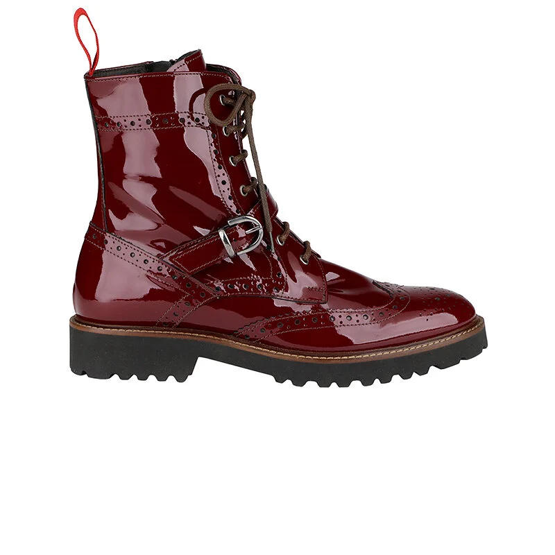 Red patent leather lace-up boot with brogue detailing and thick sole.