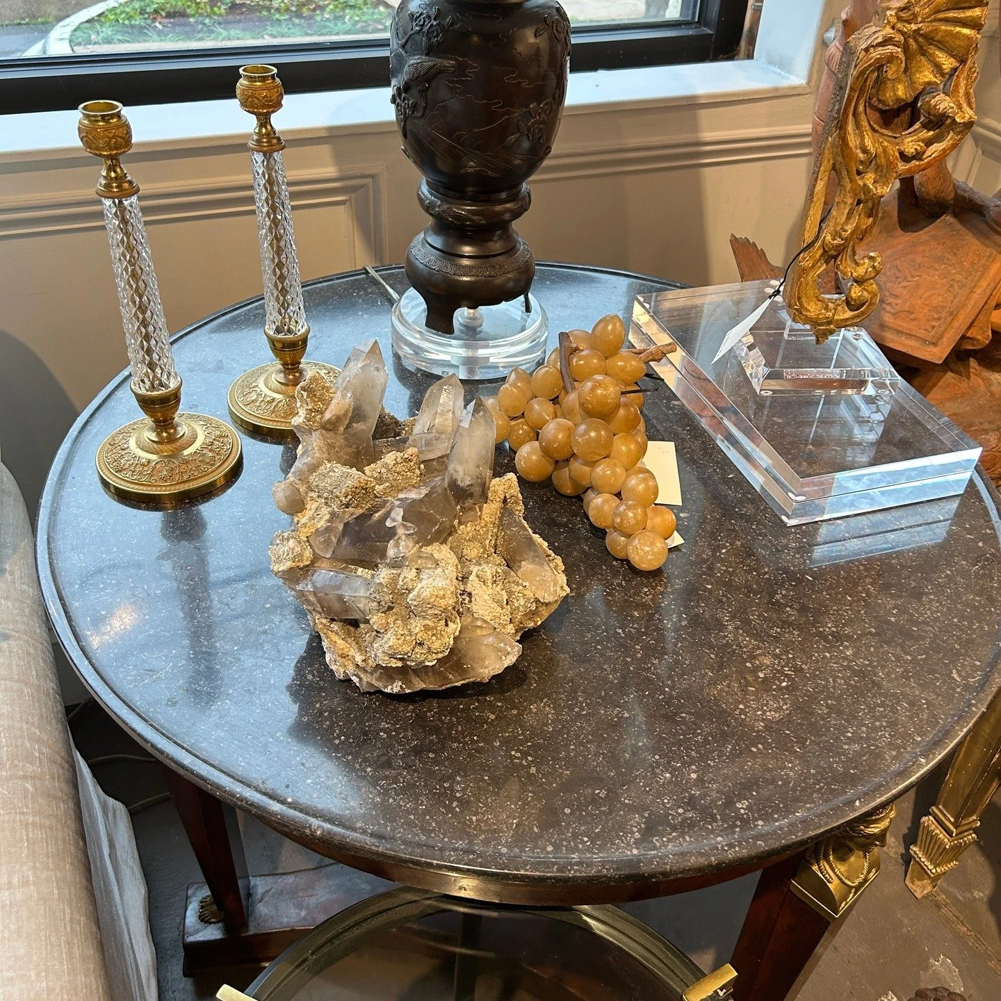This antique French Empire style round walnut pedestal table with a gilt figure and carved base features a Belgian Bluestone top.
At 1201 Slocum Street you will find both Belle Bloo, newly-quarried Belgian Bluestone products and finishes, alongside f