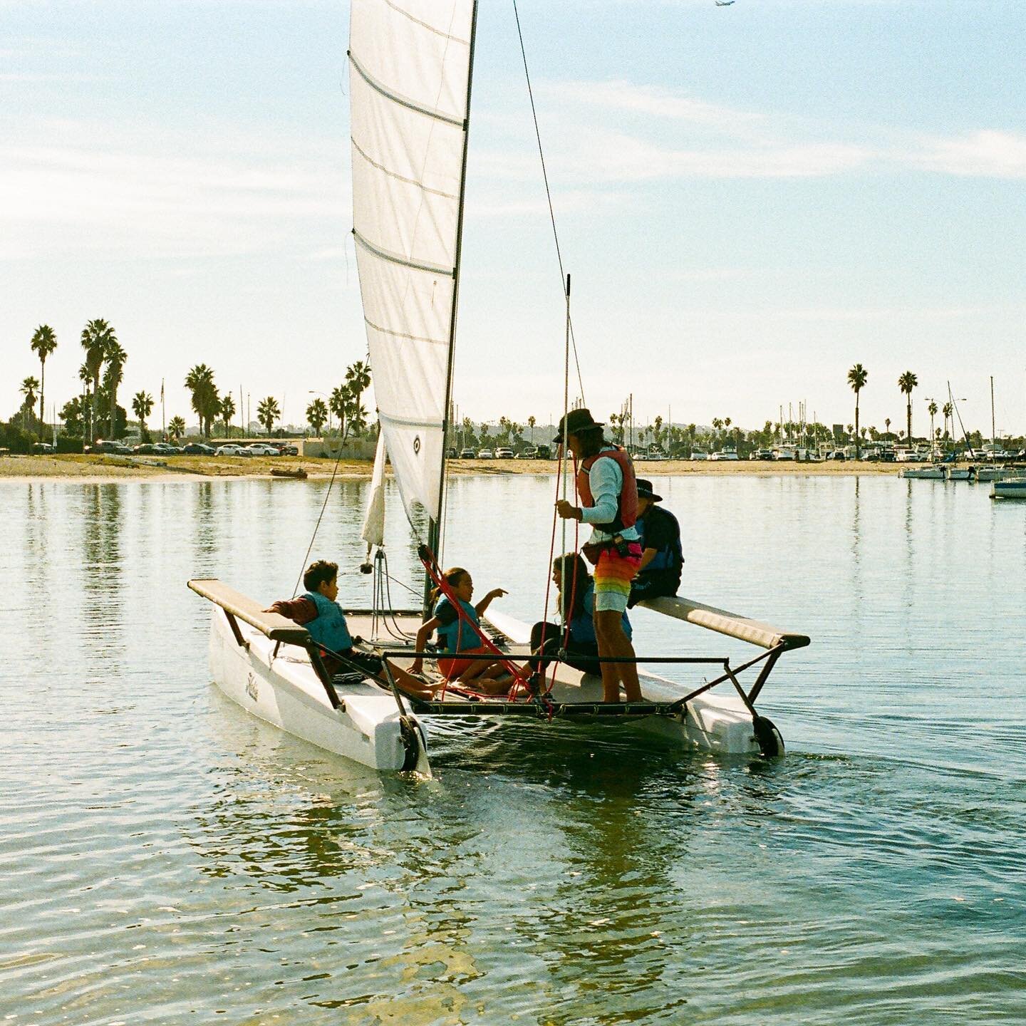 Before stepping on the Hobie Catamaran, we learned basic nautical terminology like starboard and port as well as sailing maneuvers such as tack and jibe.

Then how to read the wind and tie a line to a cleat. By that point, our students were frothing 