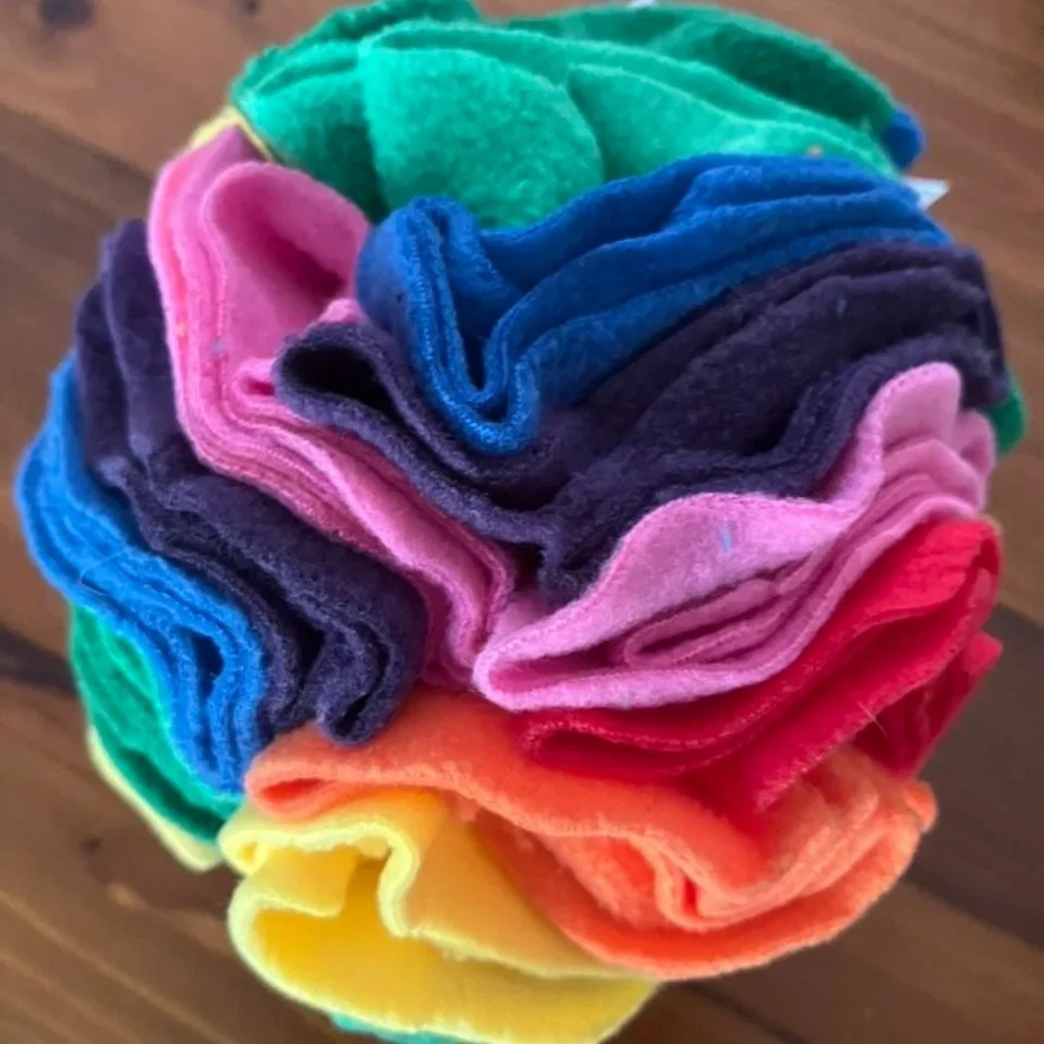 Snuffle ball for dogs, made out of bright coloured felt. Enrichment for dogs, boredom buster.