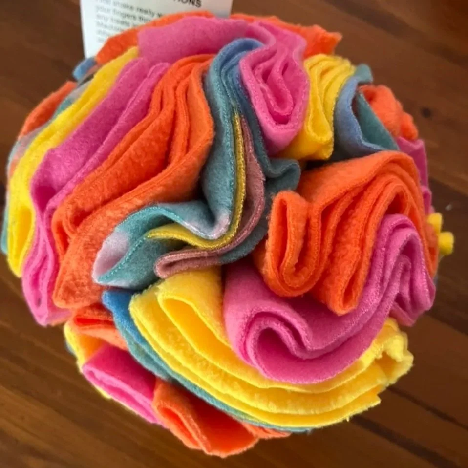 Snuffle ball for dogs, made out of bright coloured felt. Enrichment for dogs, boredom buster.