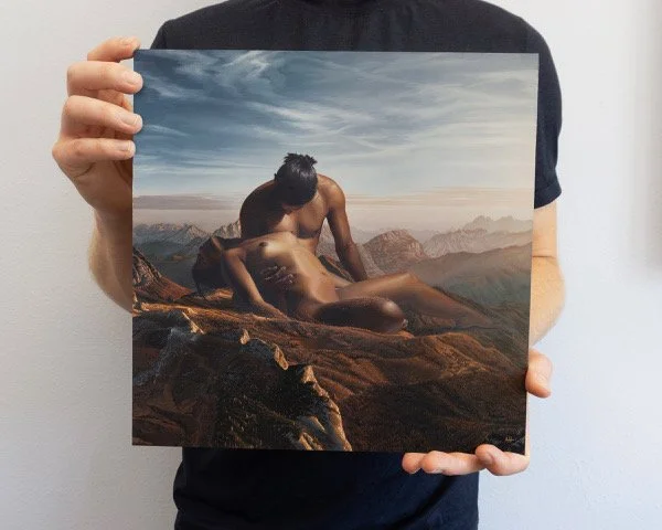 Austin Howlett holding his original painting, Same Breath