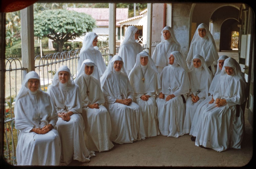 Sr Florence Bailey (seated, third from left) and Sr Mark Lehmann (seated, fifth from left) visiting the Marist Sisters in the neighbouring town of Levuka, ca 1957-ca 1958