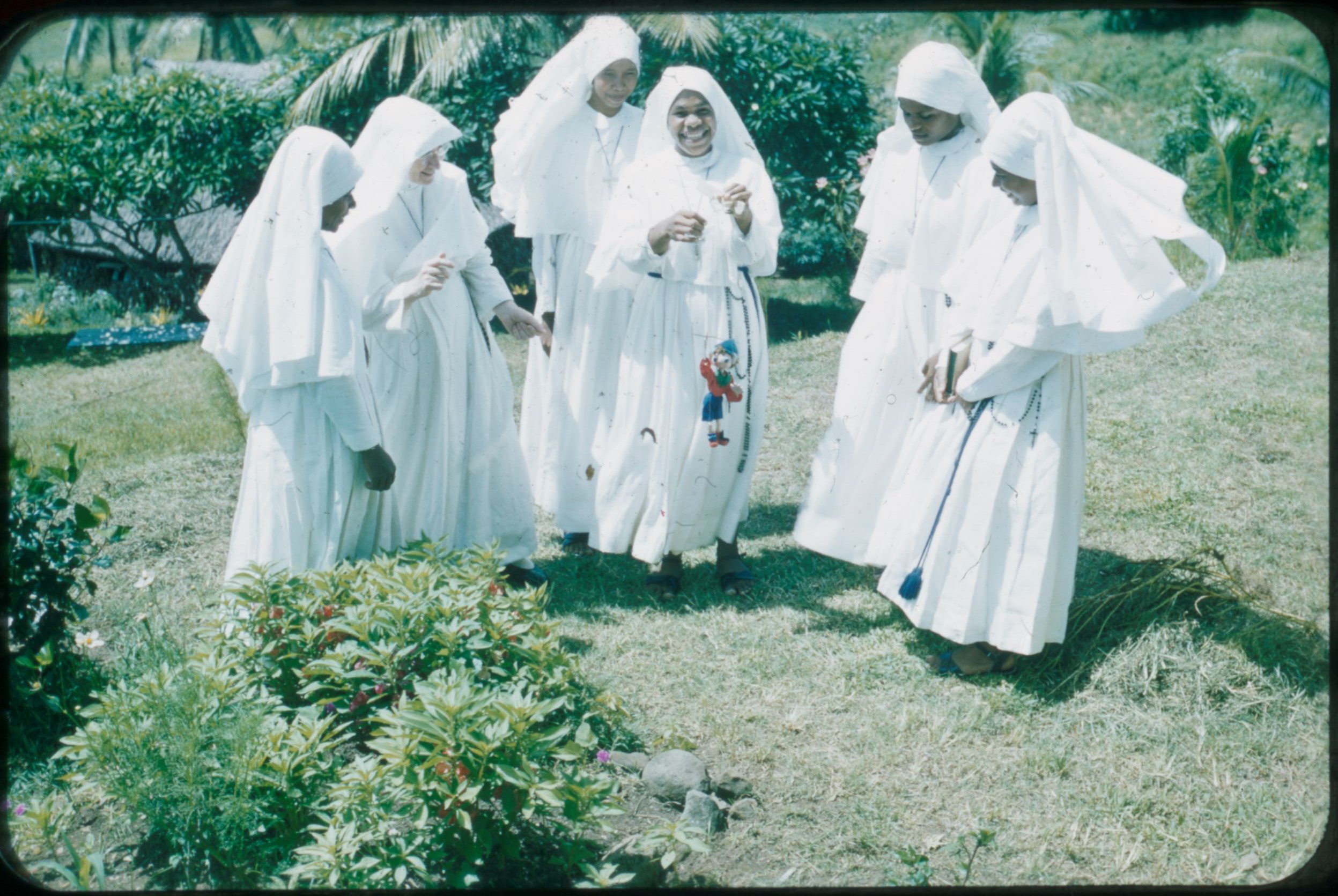 Sr Baptist Whyte and novices playing with a puppet, ca 1958-ca 1961