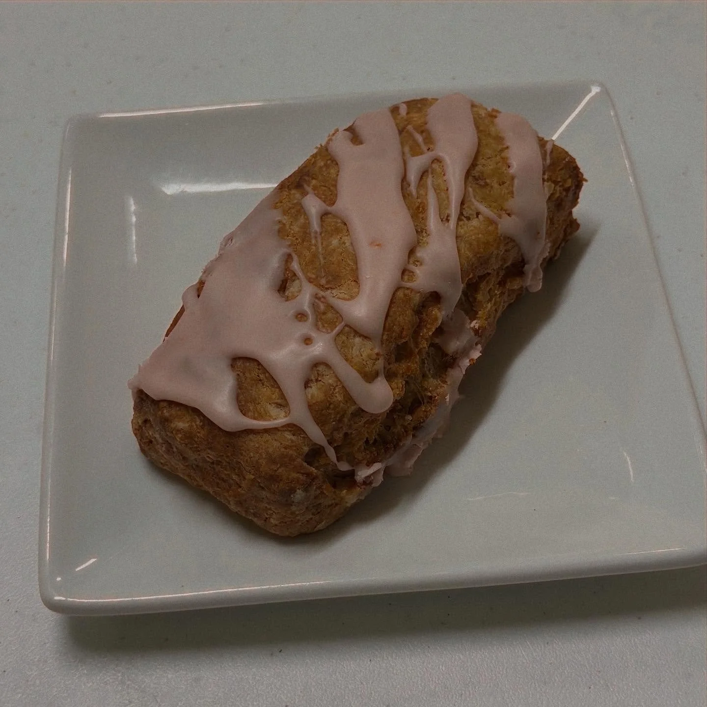 One of our favorite scones is back for the season! Roasted peach and hazelnut scone with a peach glaze.