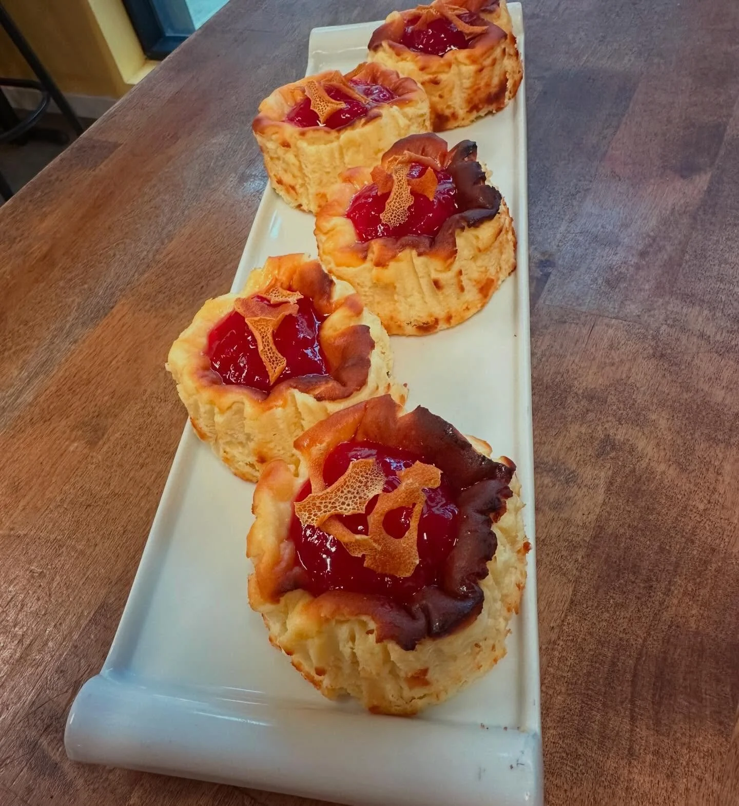 Rhubarb is here! We&rsquo;ve had such a sunny winter that it has arrived early, and I really can&rsquo;t complain! Individual Basque Cheesecakes with rhubarb compote and orange zest to garnish.