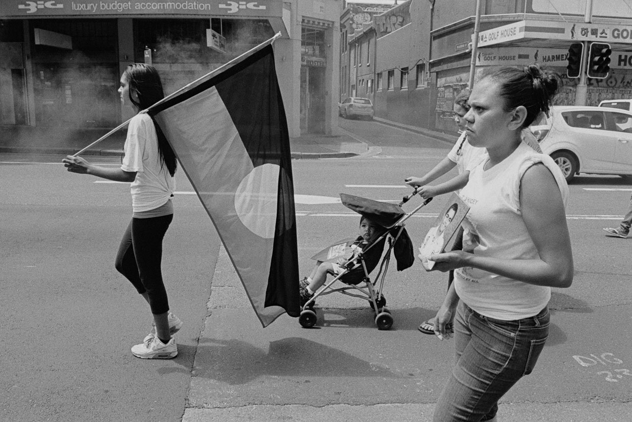    Cynthia Hickey, left, marches along Elizabeth Street, Sydney, with other family members, friends, and supporters towards NSW Parliament House to hand over a petition demanding a fresh inquest into TJ’s death, 14 February 2013. 